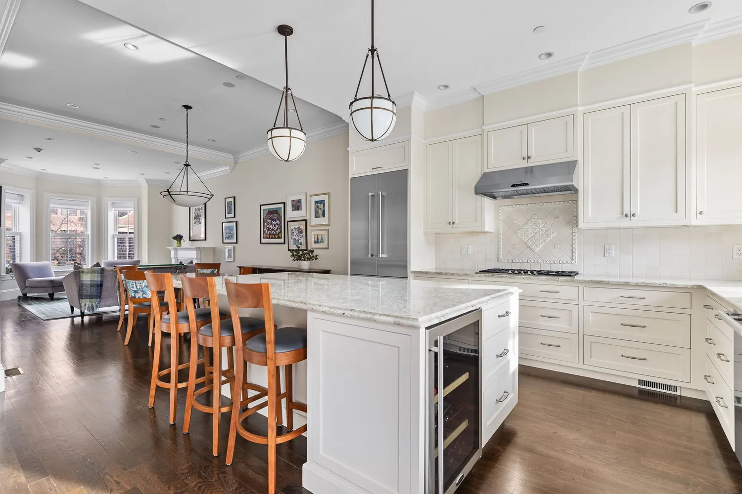a kitchen with stainless steel appliances granite countertop a kitchen island a stove and a sink