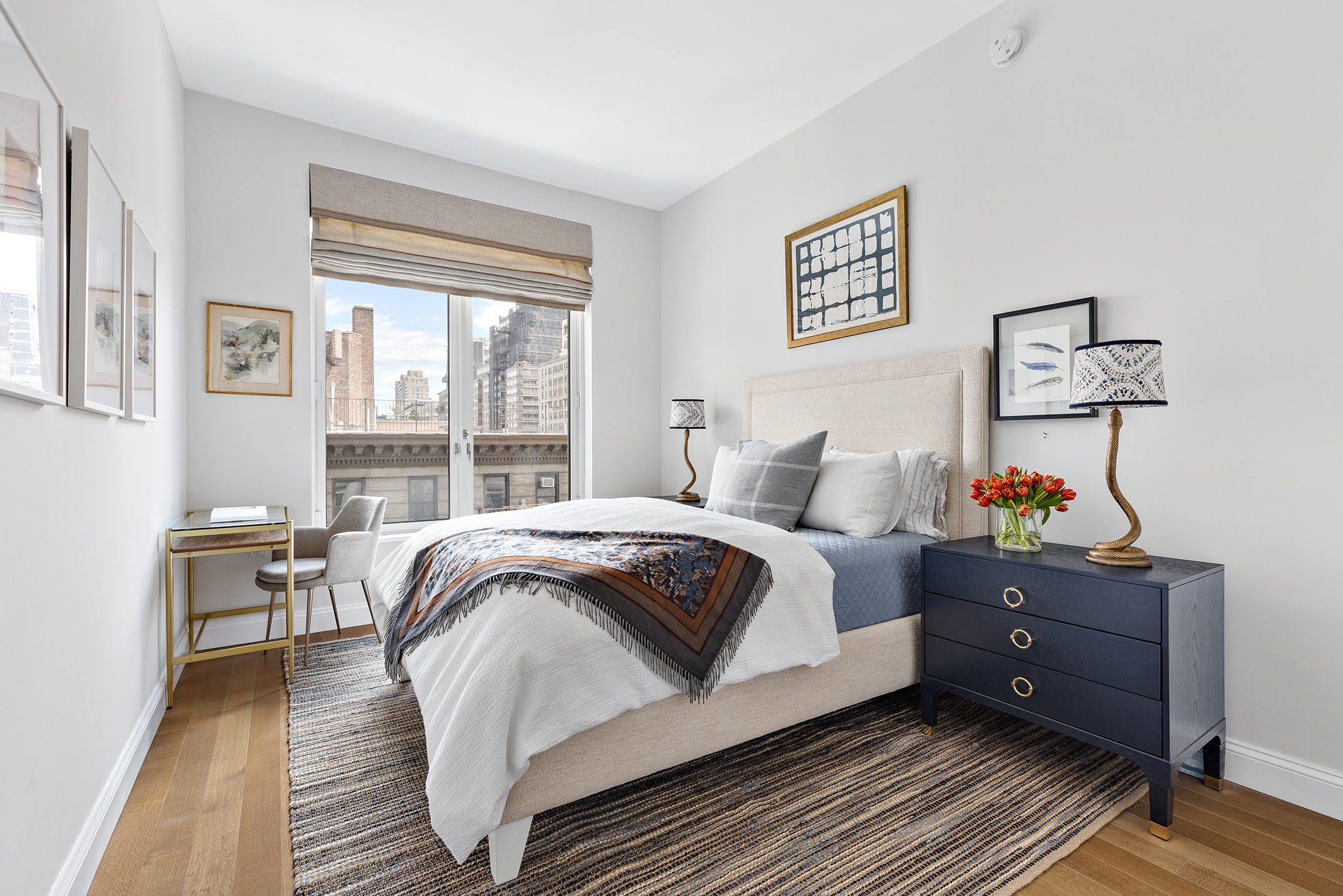 250 West 81st Street, Unit 8B Manhattan, NY 10024 - Photo 12 of 19 a bedroom with a bed and wooden floor