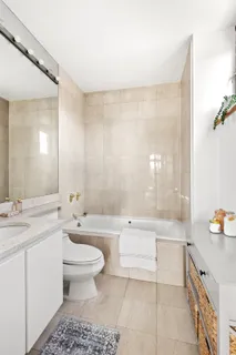 a bathroom with a sink a toilet and a bathtub