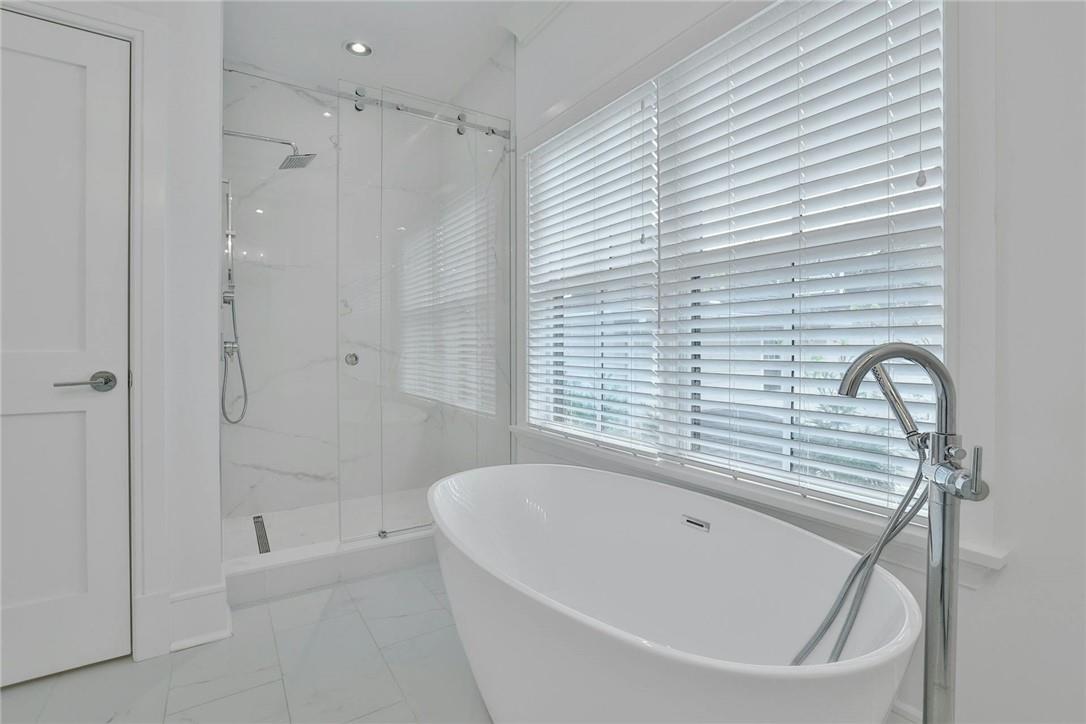 211 Purchase Street, Unit A Rye, NY 10580 - Photo 11 of 22 a bathroom with a bathtub and shower