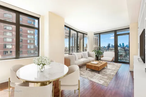 a living room with furniture and a table