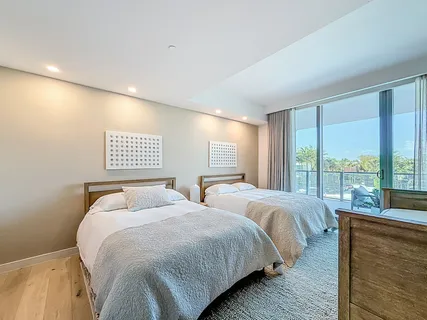 a bedroom with a bed and a mirror