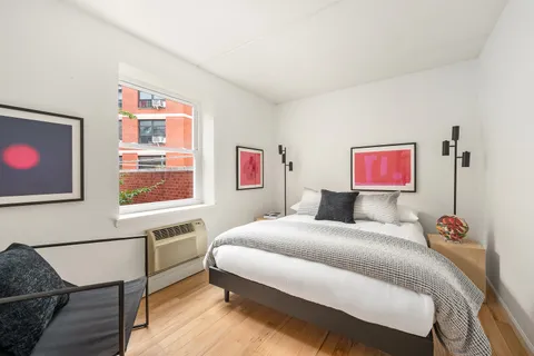 a bedroom with a bed and furniture