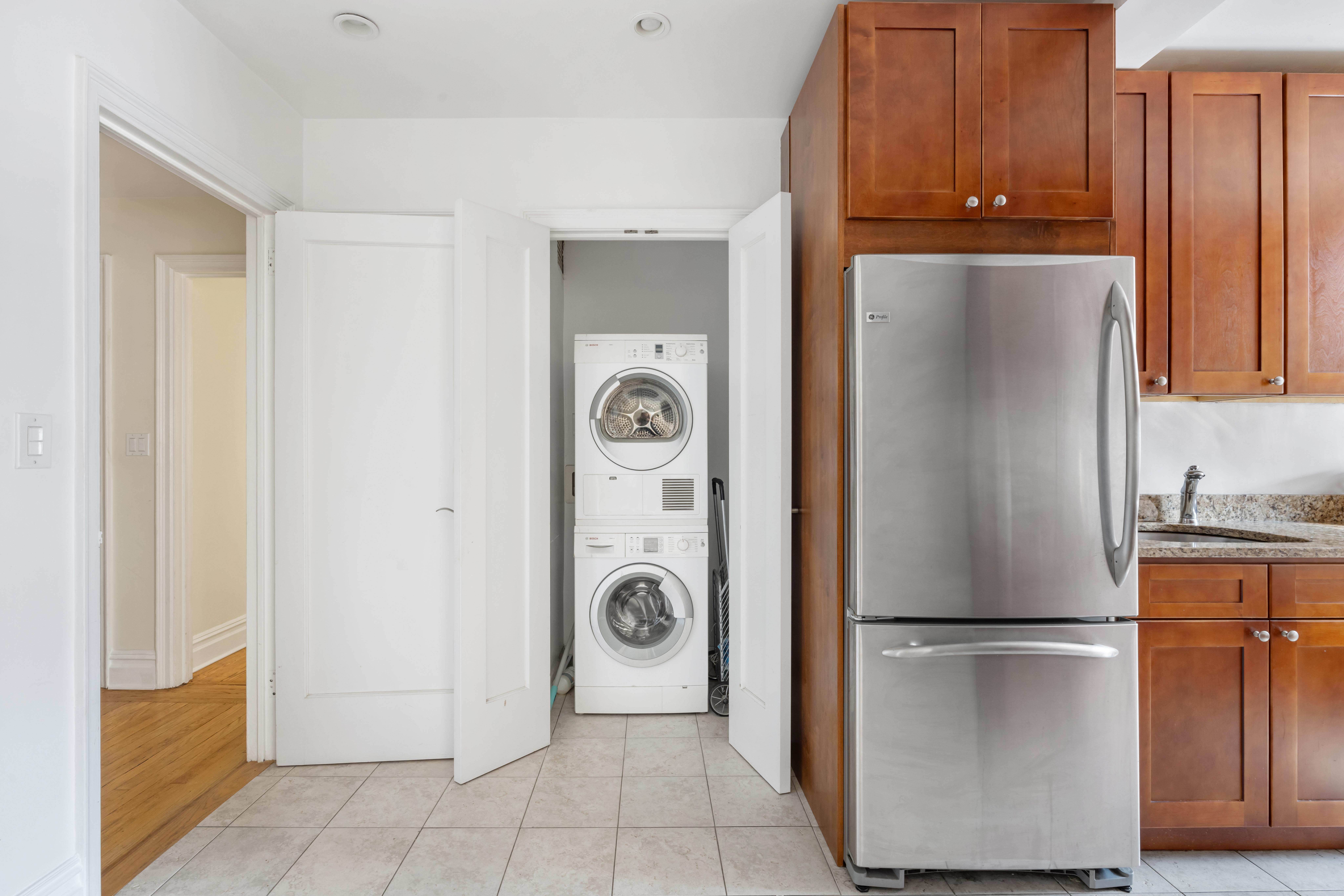444 Central Park West, Unit 5E Manhattan, NY 10025 - Photo 7 of 14 a view of a kitchen with refrigerator and cabinet
