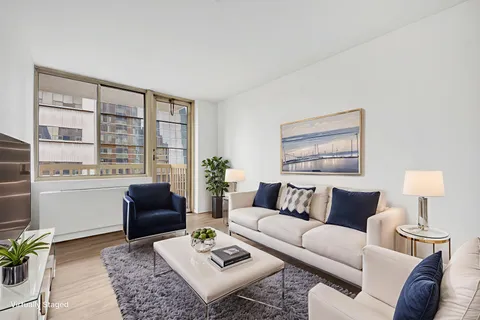 a living room with furniture and a table