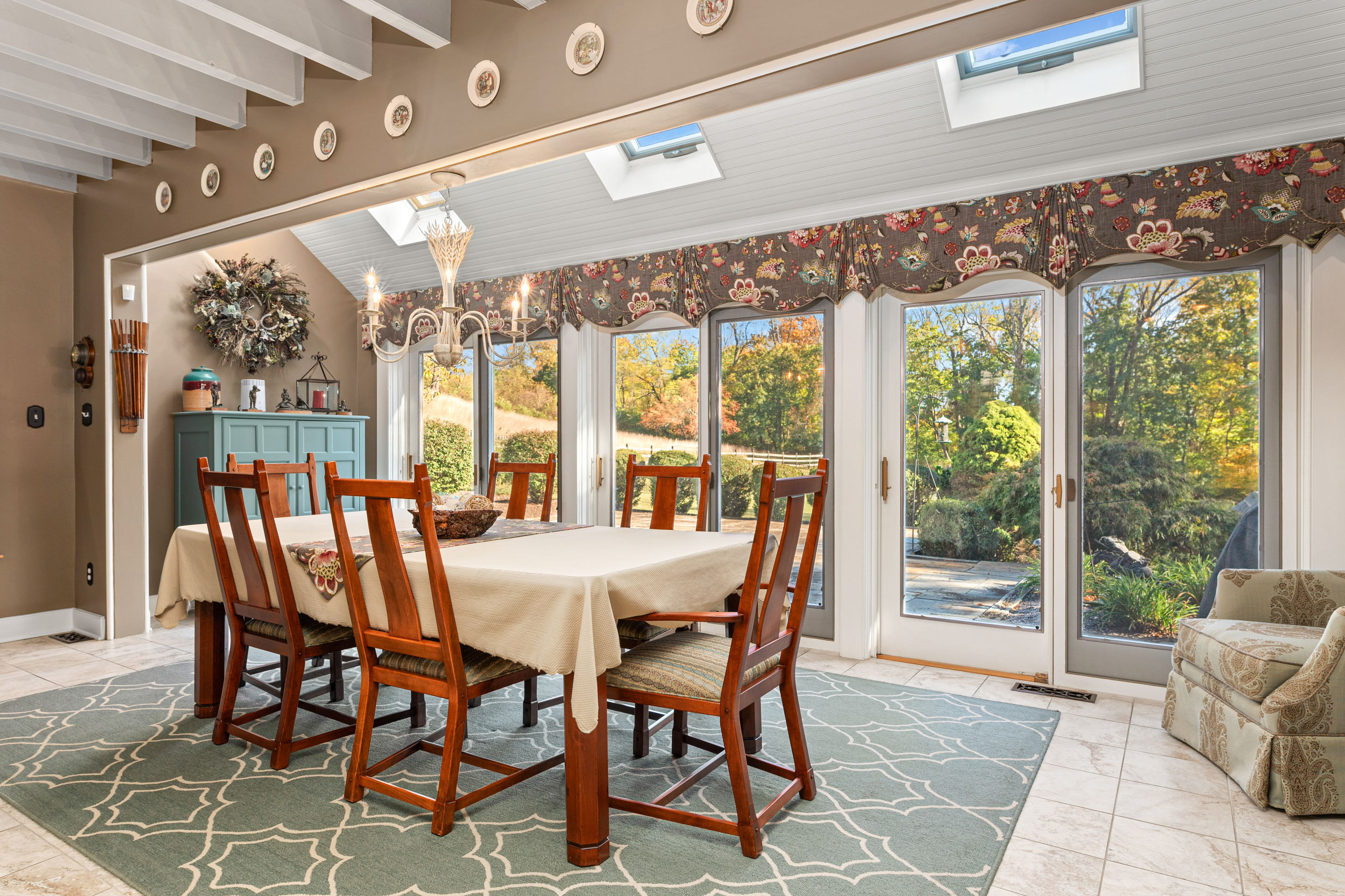 791 Grubbs Mill Road Berwyn, PA 19312 - Photo 20 of 76 a view of a dining room with furniture large windows and wooden floor