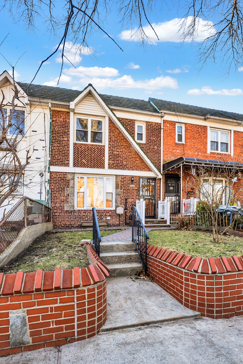 82-56 Eliot Avenue Queens, NY 11379 - Photo 1 of 7 a front view of a house with a yard