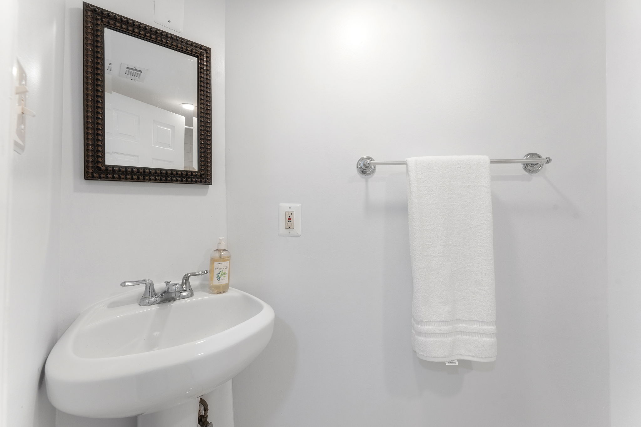 1325 Locust Road Northwest Washington, DC 20012 - Photo 47 of 56 a bathroom with a sink a mirror and vanity
