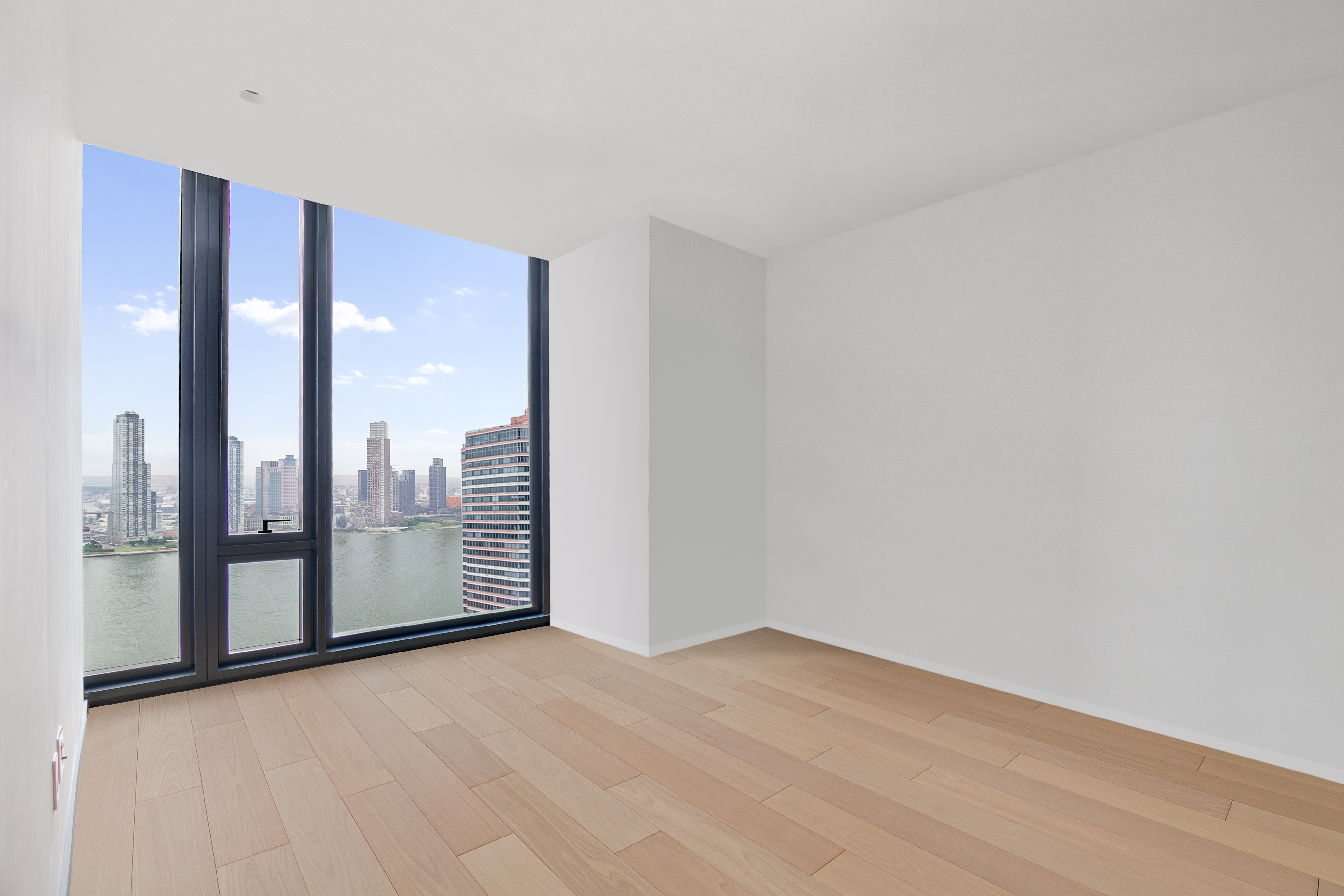 695 1st Avenue, Unit 31C Manhattan, NY 10016 - Photo 11 of 27 a view of a room with floor to ceiling window