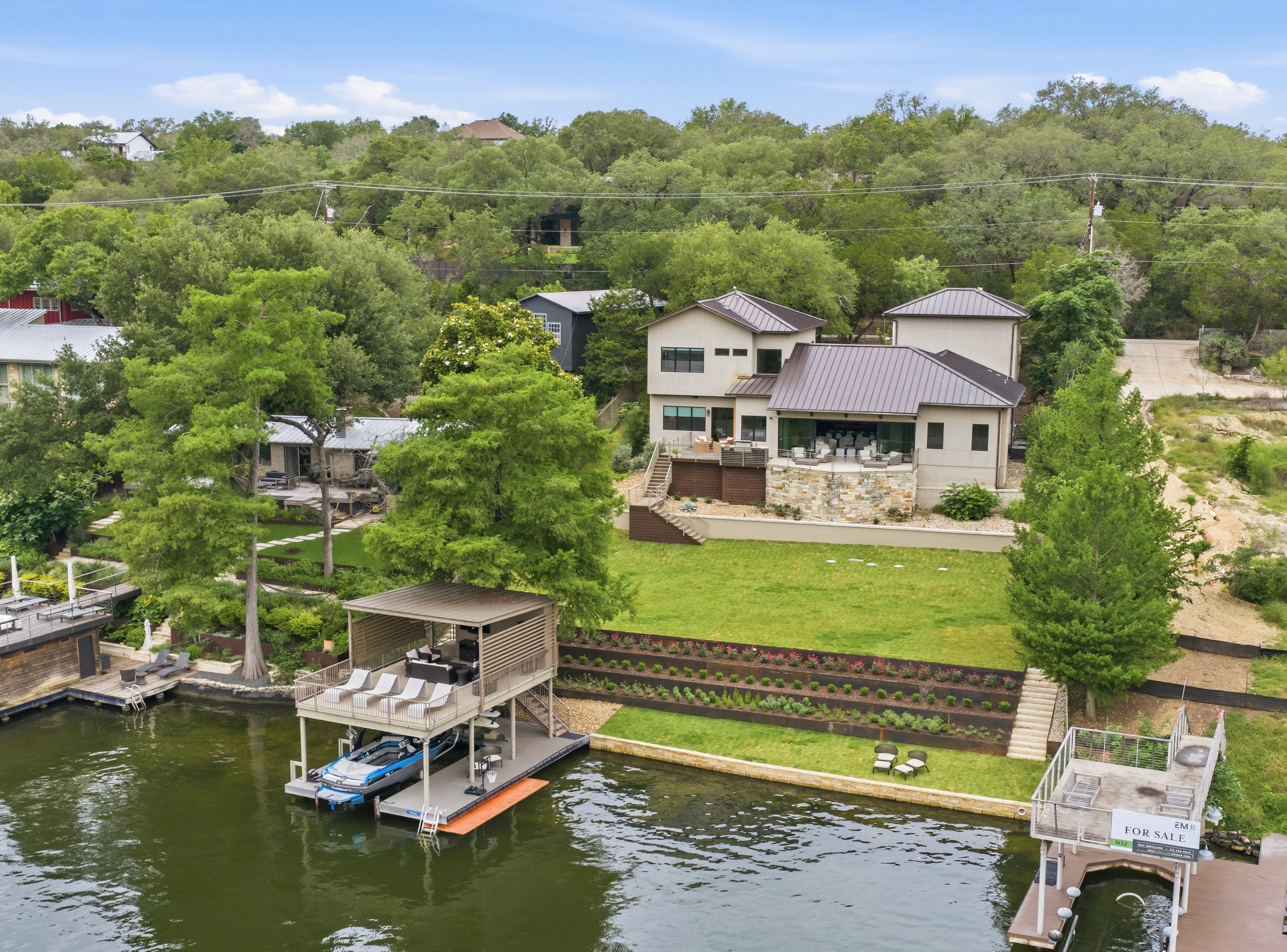 3605 Robbins Road Austin, TX 78730 - Photo 2 of 51 an aerial view of a house with a garden and lake view