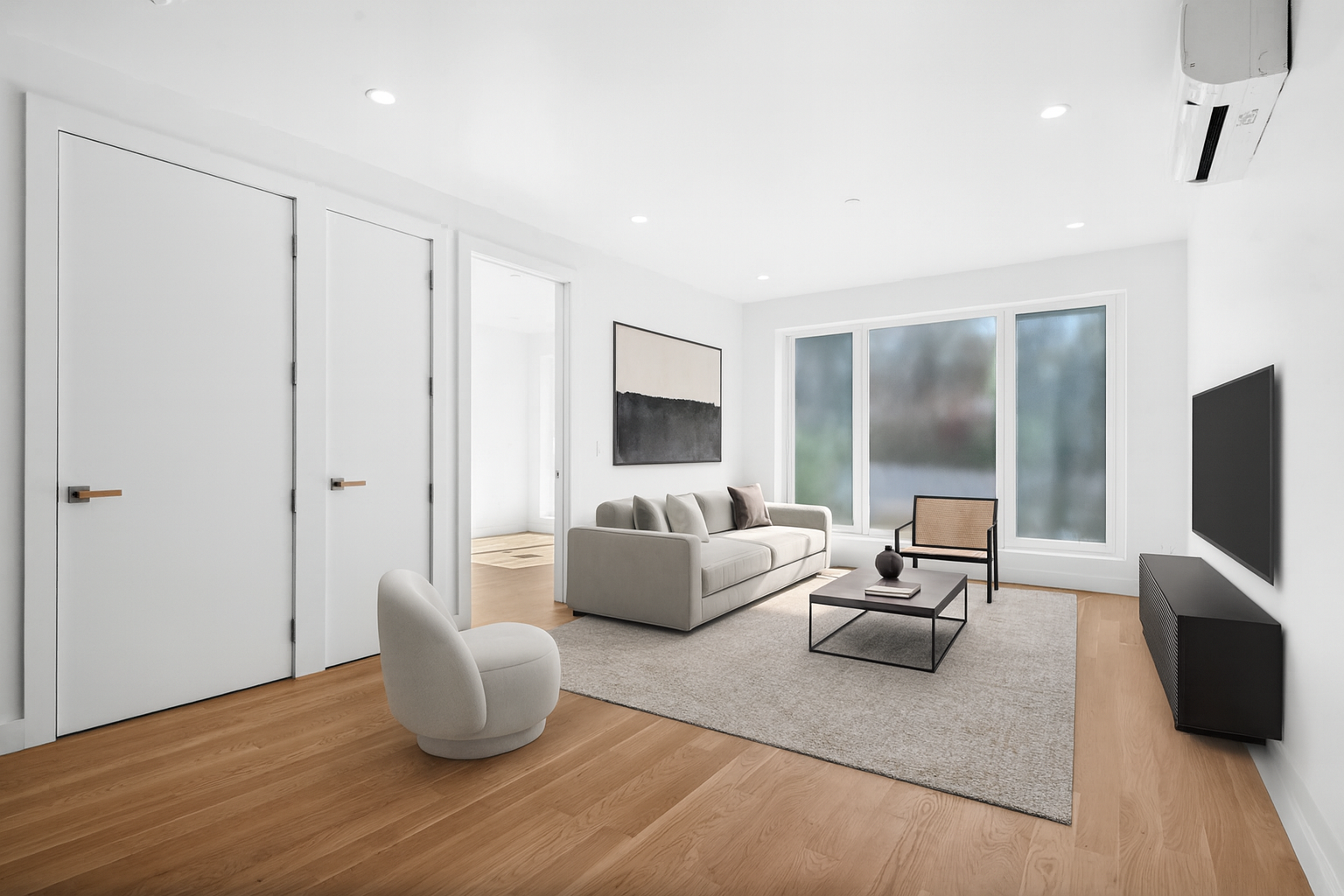a living room with furniture and a flat screen tv