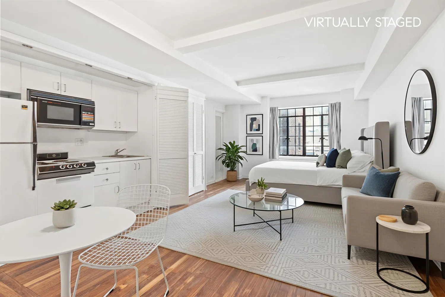 a living room with furniture a flat screen tv and a table
