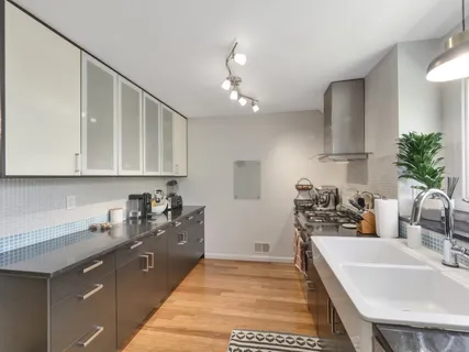 a kitchen with a stove and a sink