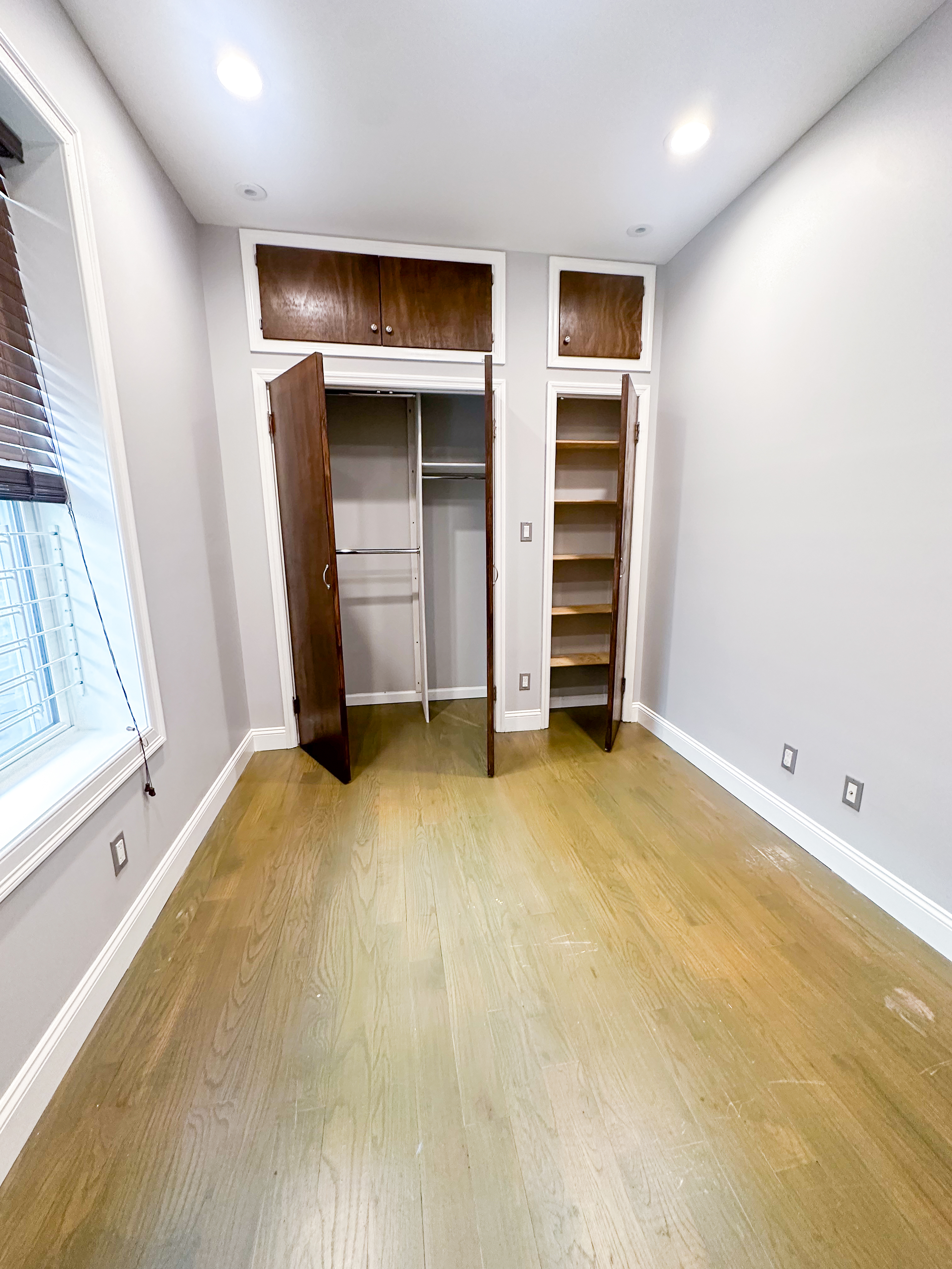 567 New Jersey Avenue, Unit 2 Brooklyn, NY 11207 - Photo 7 of 11 an empty room with closet and mirror