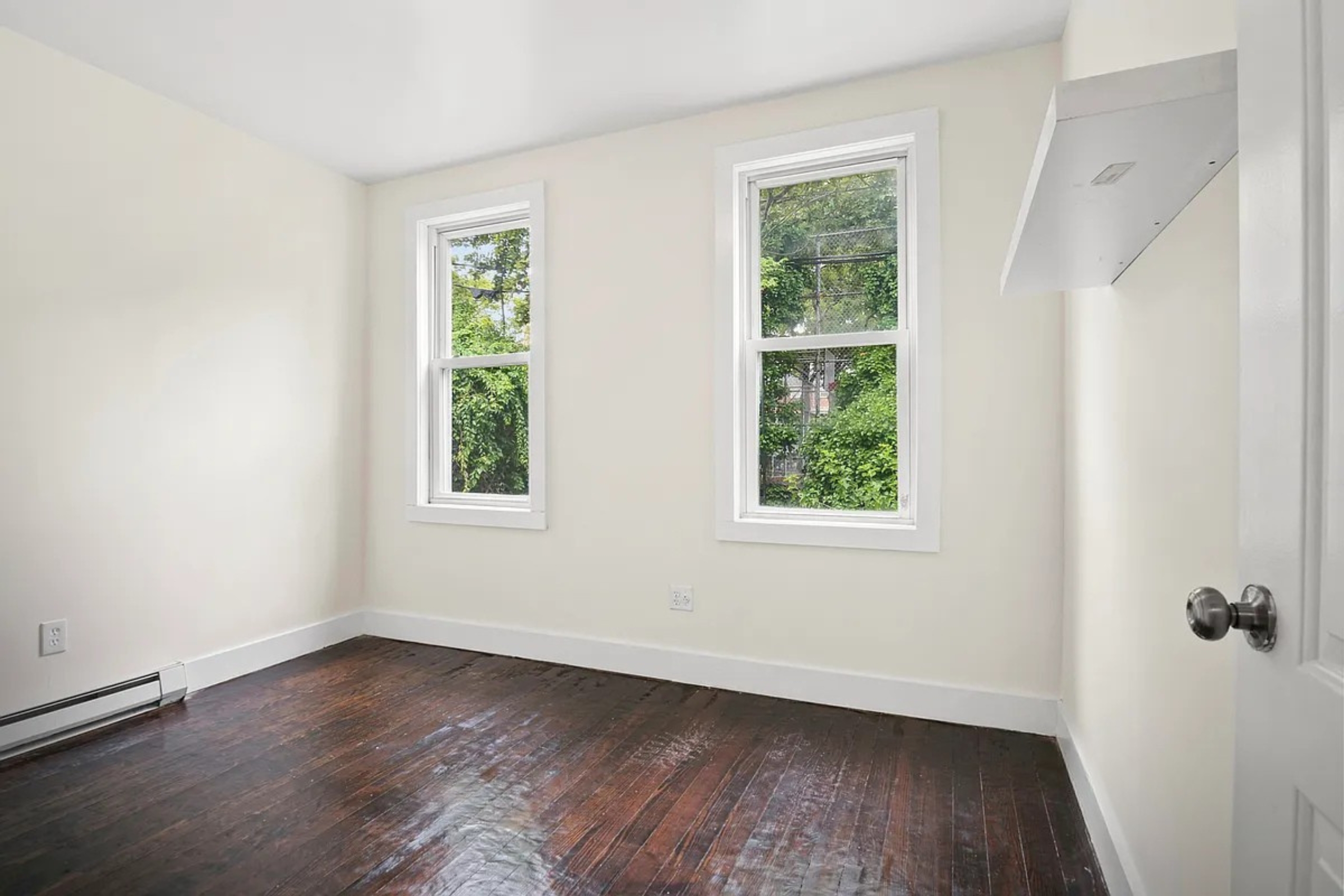 22-42 41st Street, Unit 2R Queens, NY 11105 - Photo 9 of 10 an empty room with a window