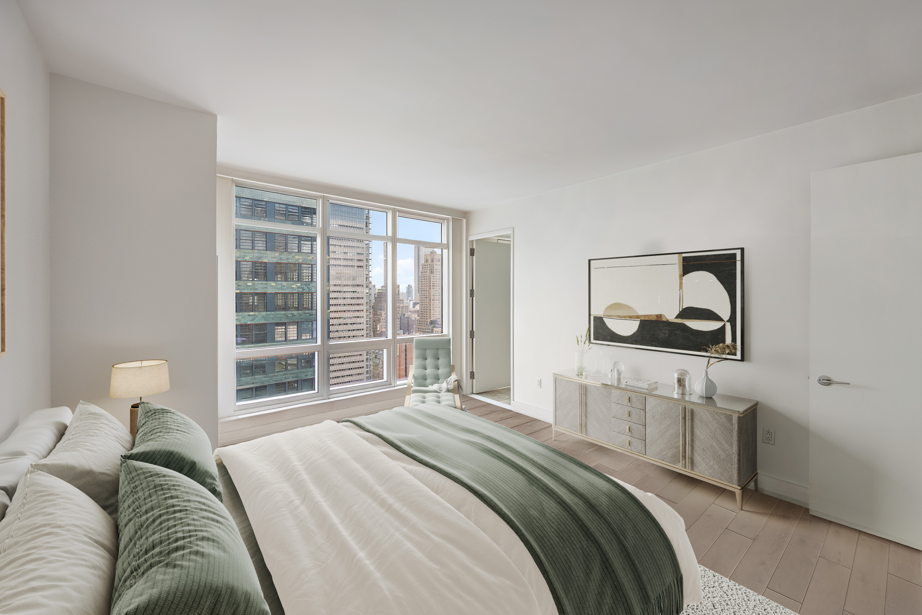 350 West 42nd Street, Unit 37G Manhattan, NY 10036 - Photo 10 of 14 a bedroom with a bed and a window
