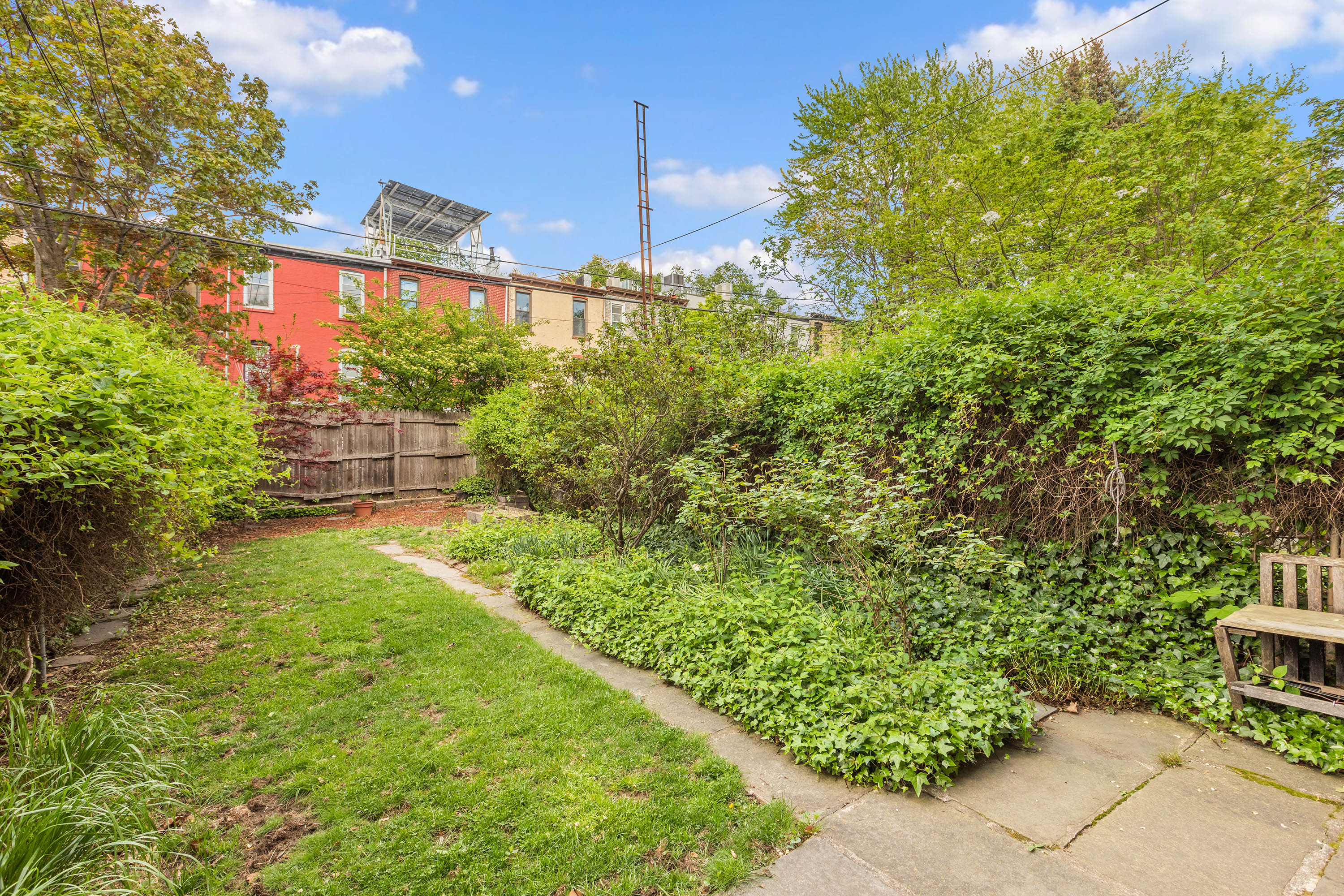 449 11th Street Brooklyn, NY 11215 - Photo 13 of 17 a view of a yard with plants and a fountain