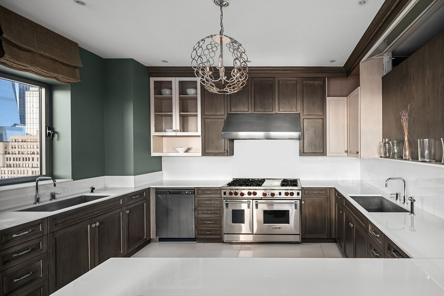a kitchen with stainless steel appliances granite countertop a sink stove and cabinets