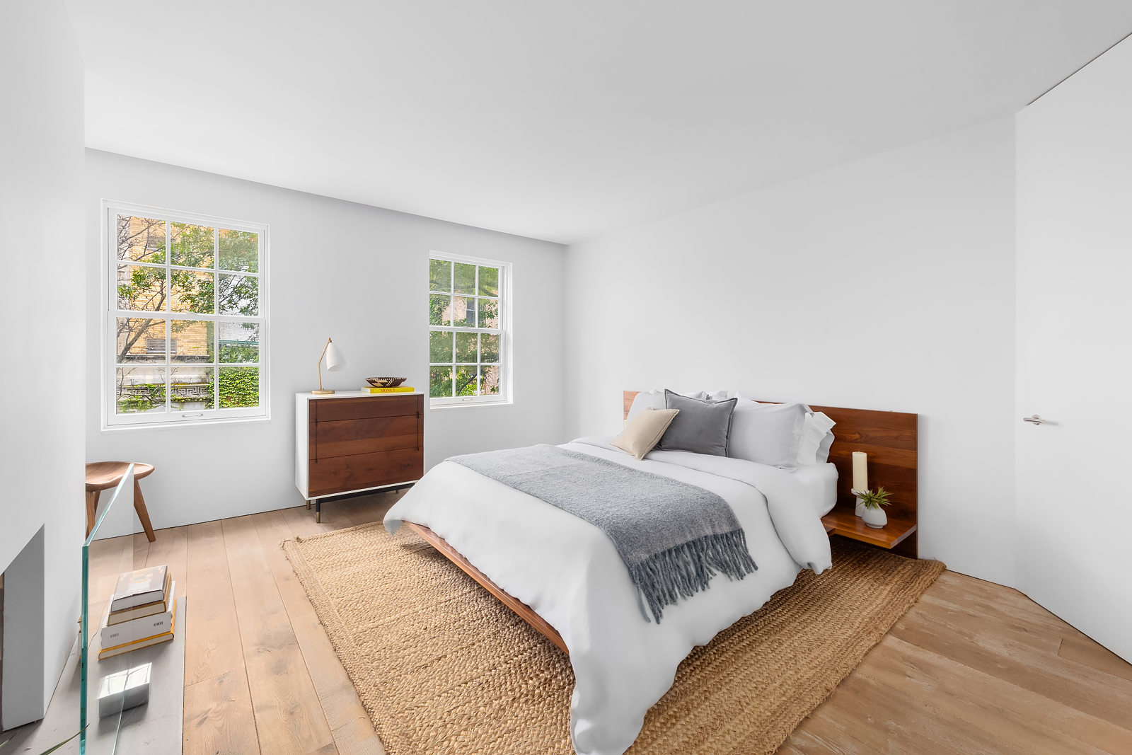 130 Charles Street Manhattan, NY 10014 - Photo 9 of 14 a bedroom with a large bed and a window