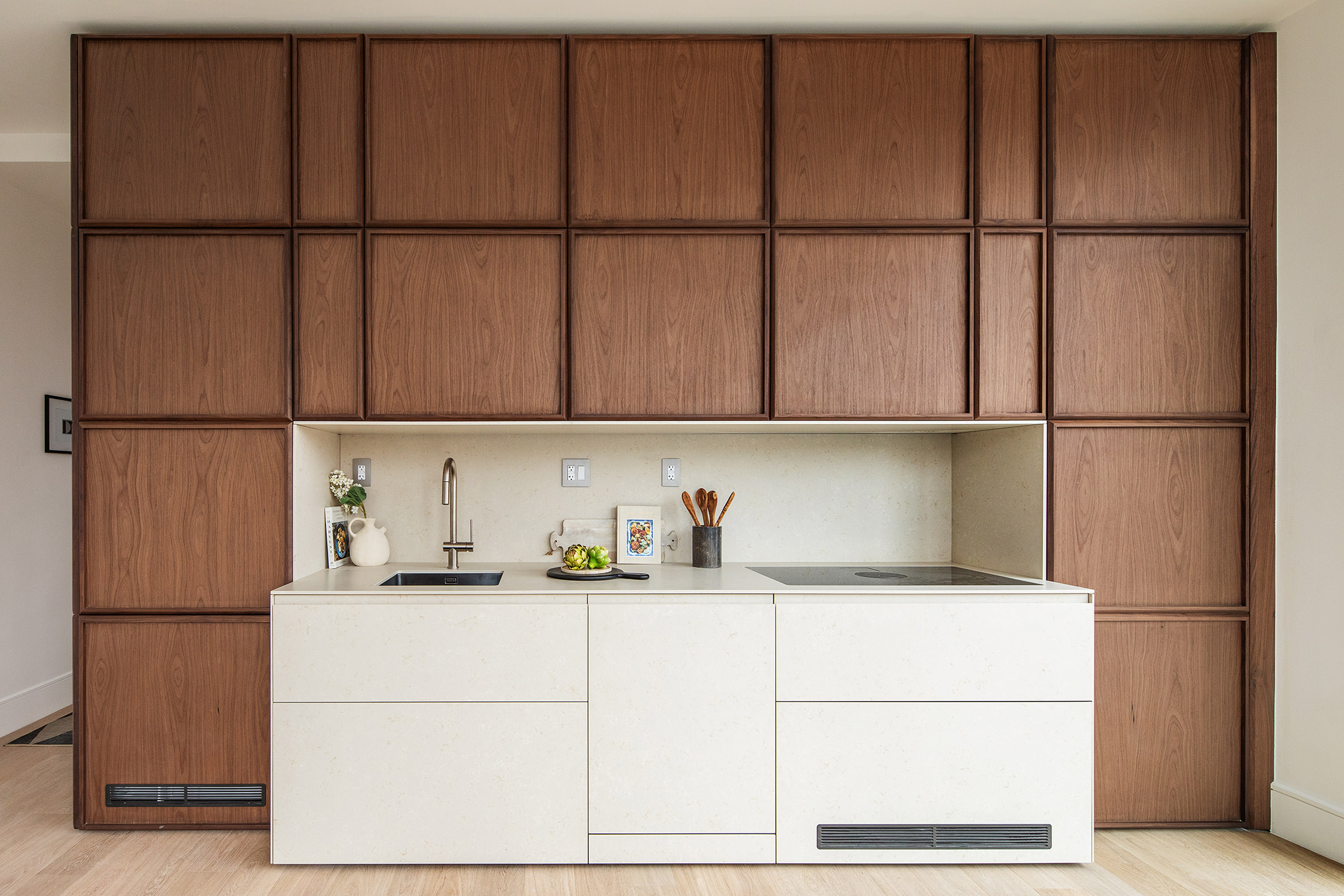 a kitchen with a refrigerator and cabinets