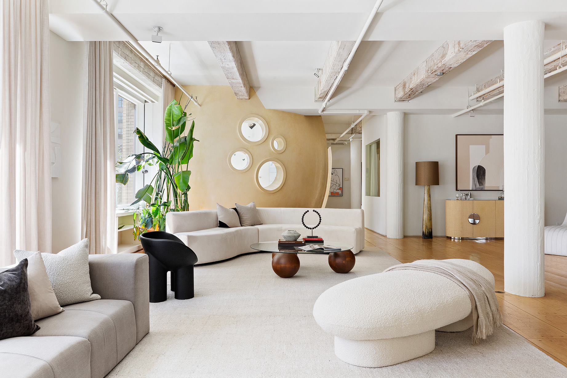 145 6th Avenue, Unit 2B Manhattan, NY 10013 - Photo 11 of 23 a living room with furniture and a large window