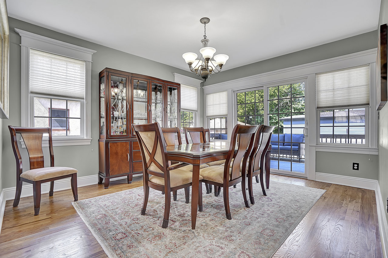 266 Feronia Way Rutherford, NJ 07070 - Photo 8 of 41 a view of a dining room with furniture a chandelier and wooden floor