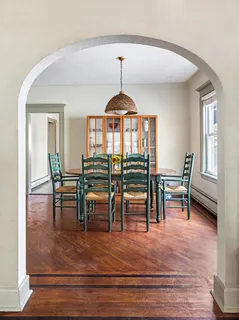 a view of dining room with furniture and window
