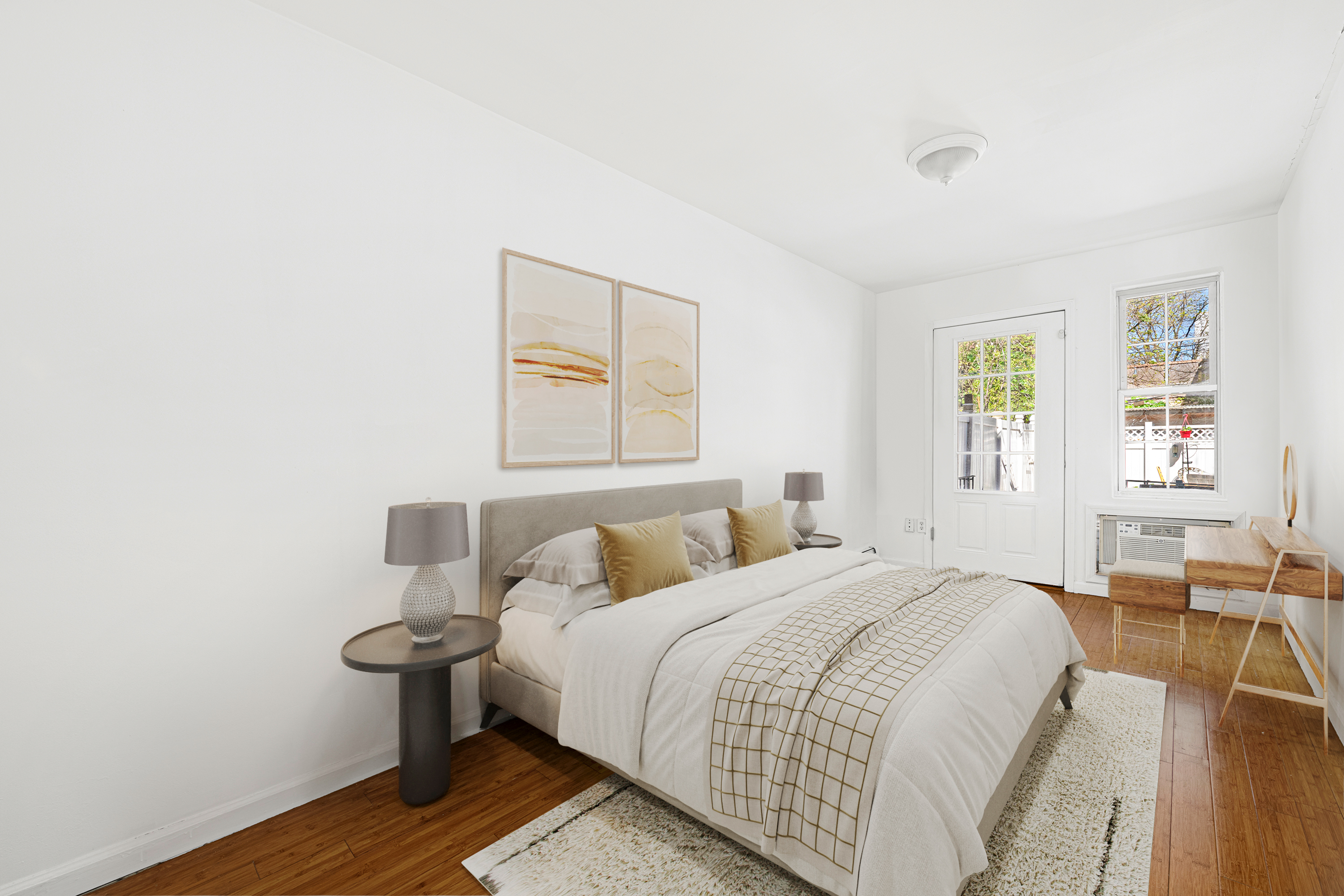 545 Gates Avenue, Unit 1 Brooklyn, NY 11216 - Photo 6 of 10 a bedroom with a bed and wooden floor