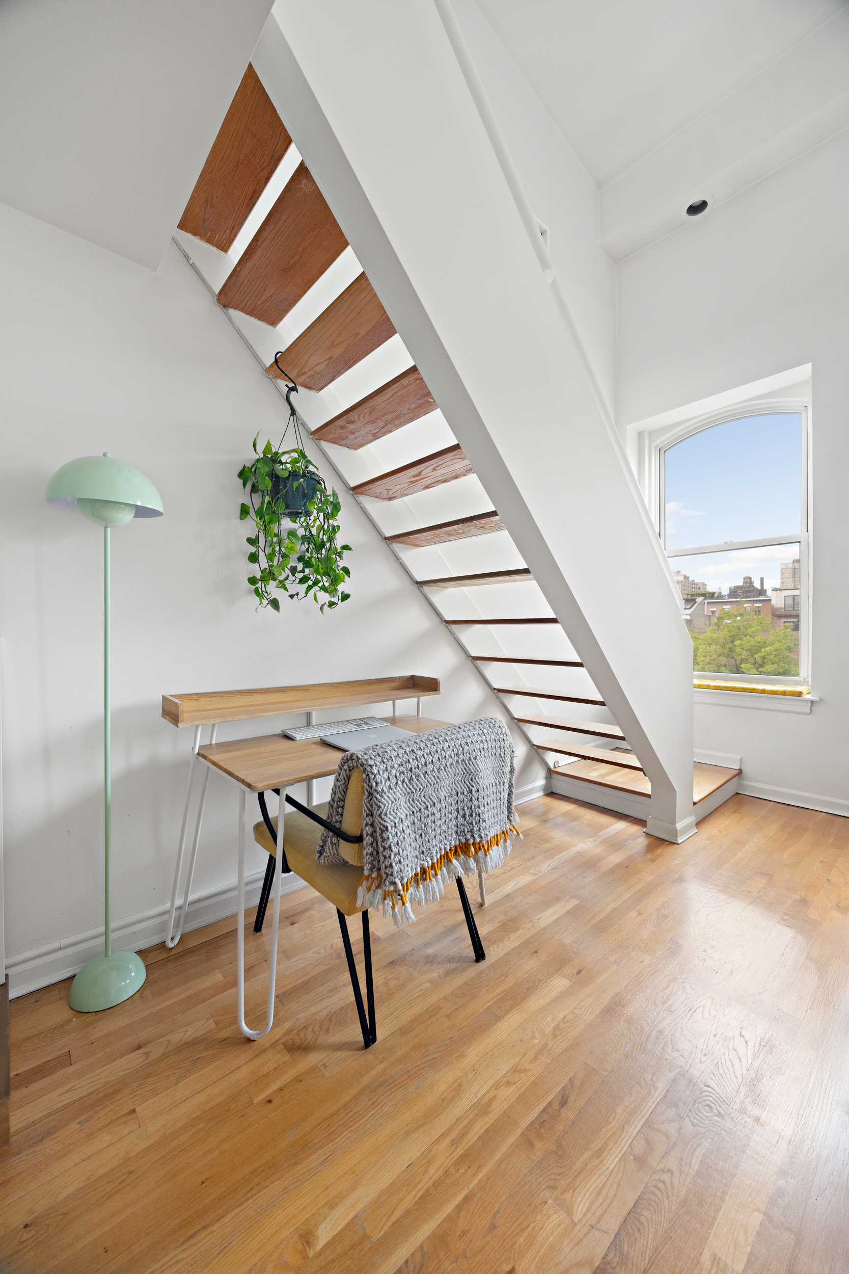 124 Atlantic Avenue, Unit A4H Brooklyn, NY 11201 - Photo 13 of 19 a view of a hallway with wooden floor and a potted plant