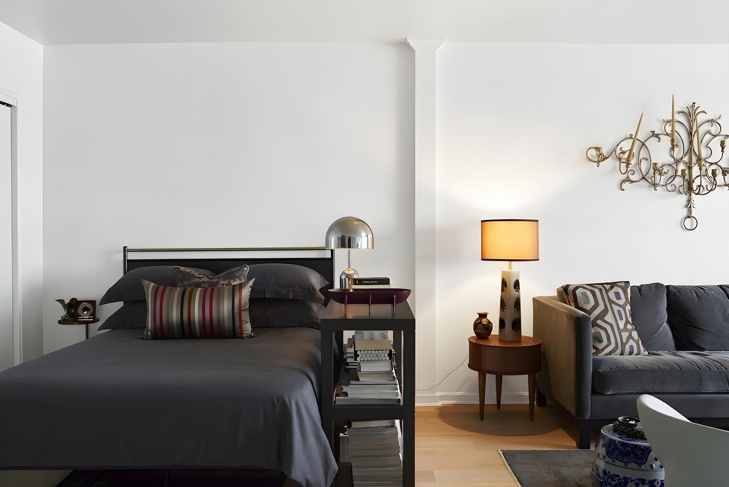 101 West 12th Street, Unit 15P Manhattan, NY 10011 - Photo 4 of 16 a bedroom with a bed and wooden floor