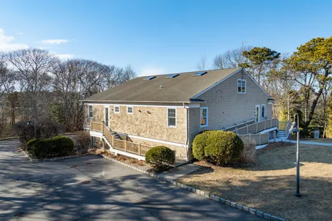 a view of a car park in front of house