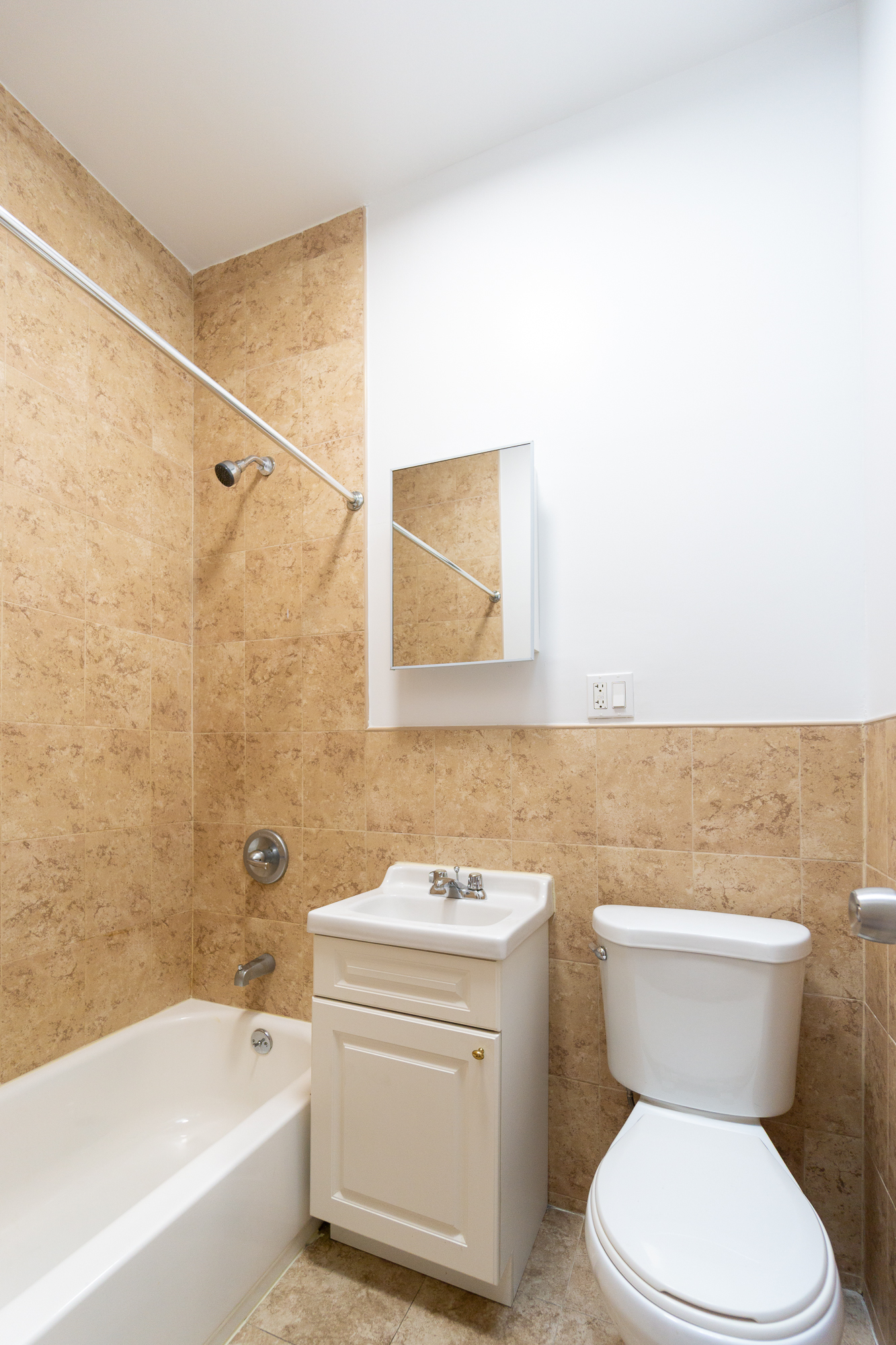 320 West 20th Street, Unit 15 Manhattan, NY 10011 - Photo 6 of 14 a bathroom with a toilet a sink and bathtub
