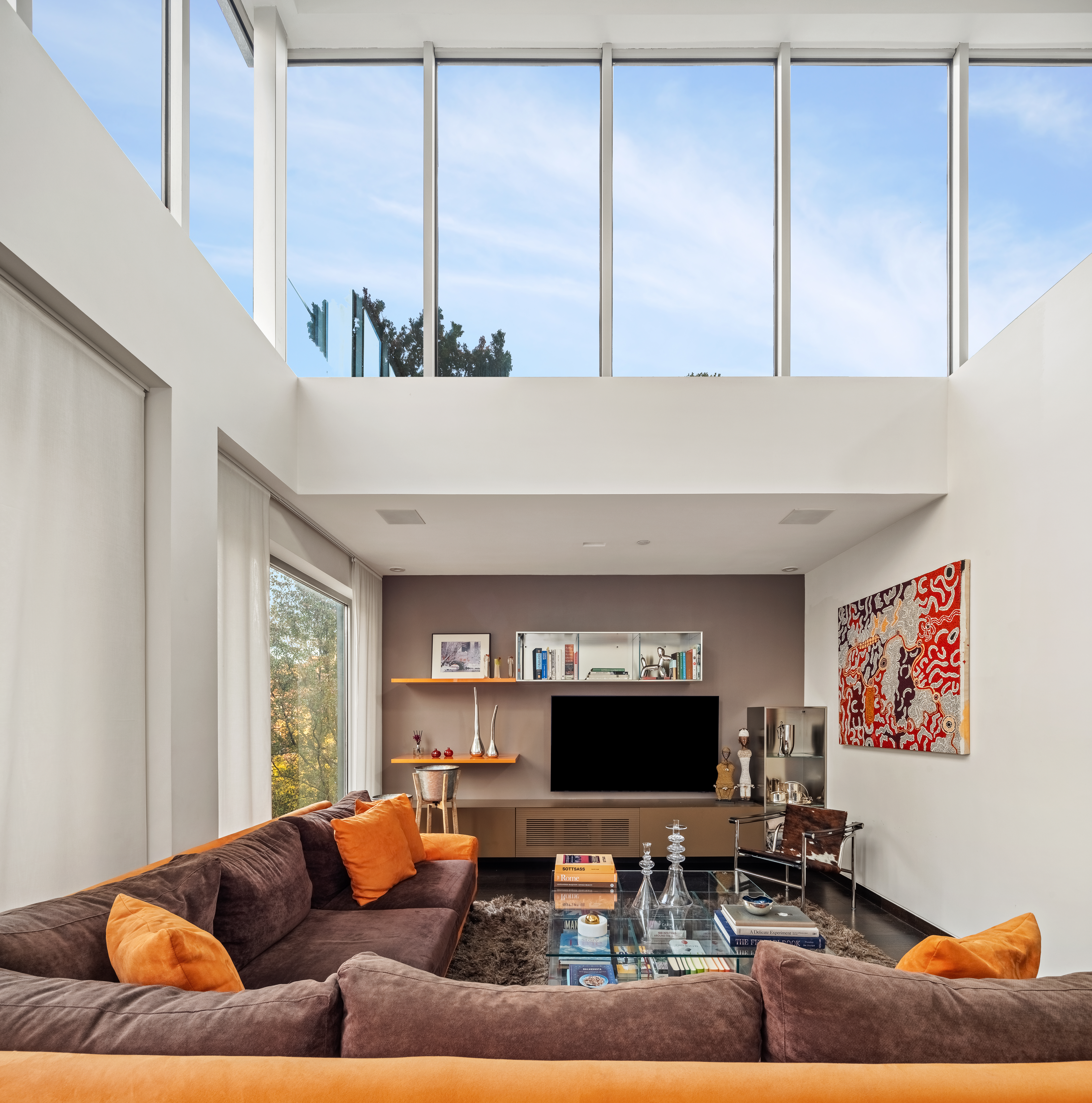 78 South 3rd Street, Unit 3 Brooklyn, NY 11249 - Photo 4 of 17 a living room with furniture and a flat screen tv