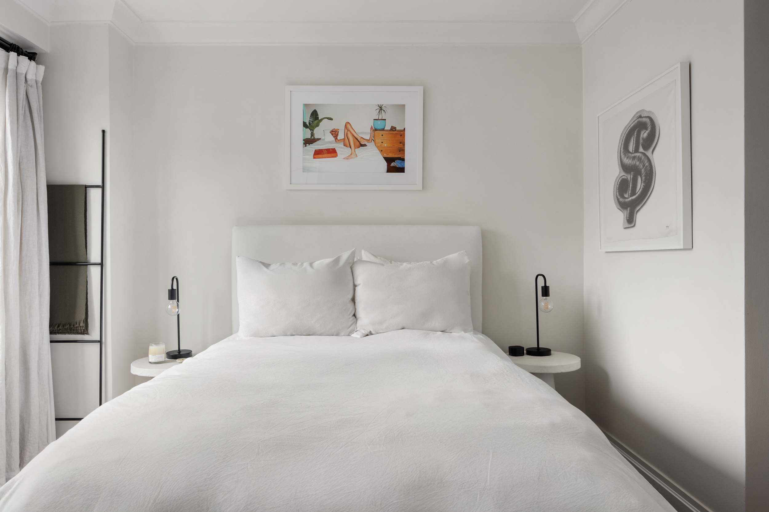 175 West 12th Street, Unit 4L Manhattan, NY 10011 - Photo 8 of 11 a bedroom with a bed and a refrigerator