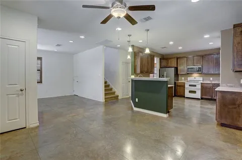 a view of a kitchen with a sink and cabinets