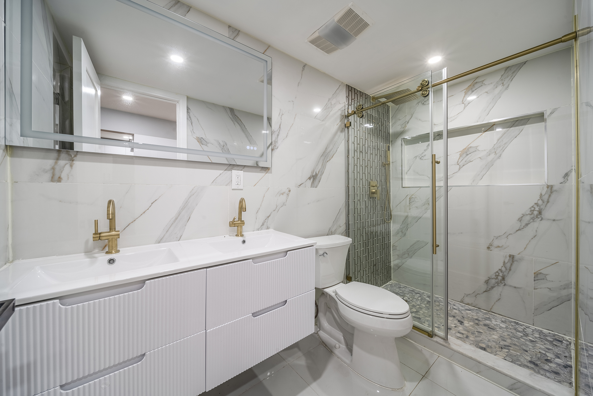 192 Weirfield Street, Unit ONE Brooklyn, NY 11221 - Photo 5 of 8 a bathroom with a toilet sink and shower