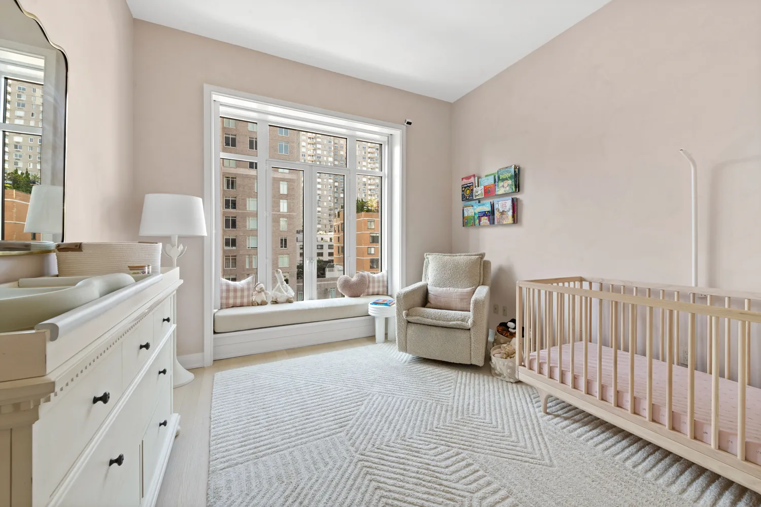 a spacious bedroom with a bed and a large window
