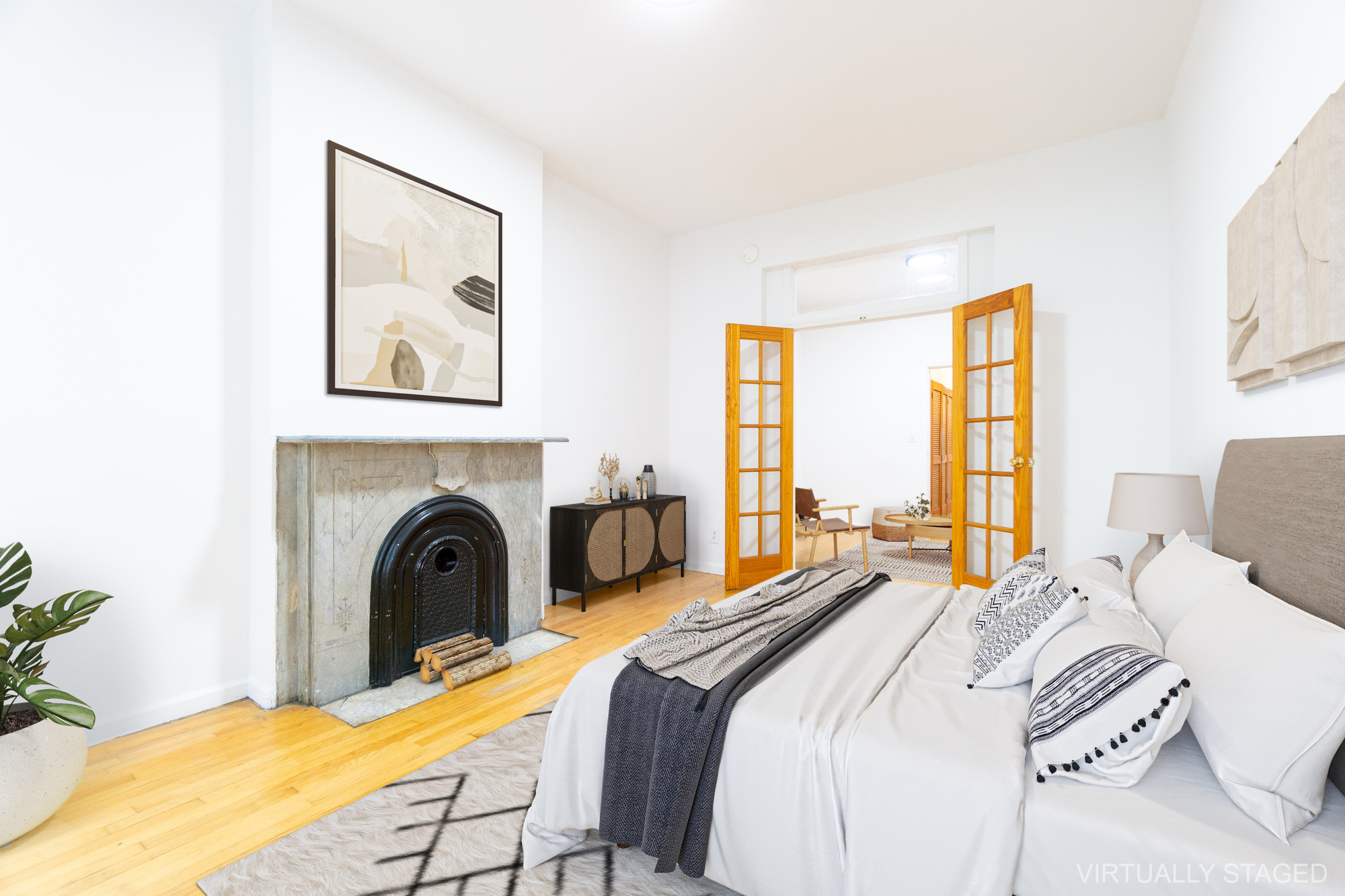 215 East 5th Street, Unit 3 Manhattan, NY 10003 - Photo 3 of 25 a bedroom with a bed and a fireplace