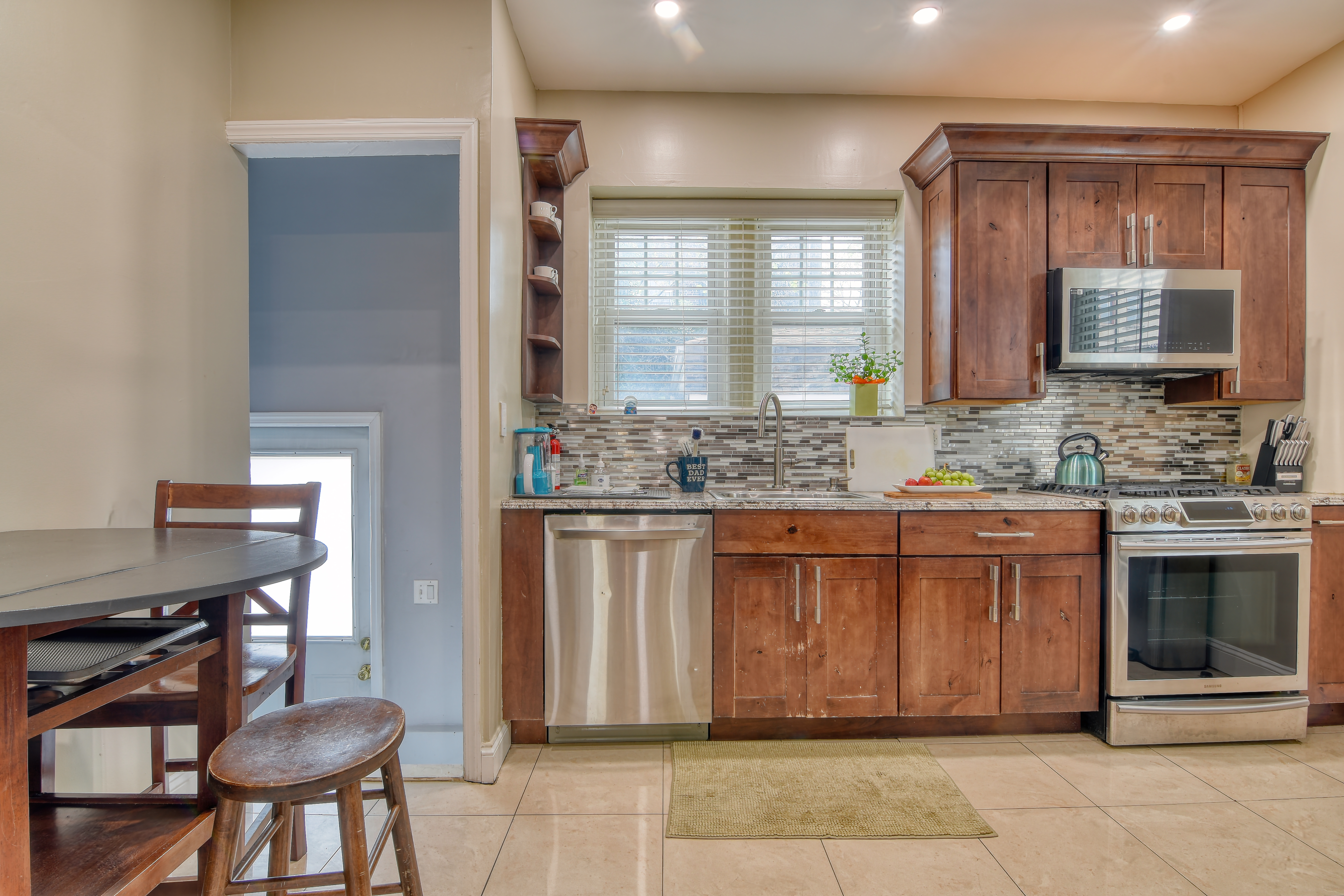 232 Maple Street Brooklyn, NY 11225 - Photo 9 of 16 a spacious bathroom with a granite countertop sink and a mirror