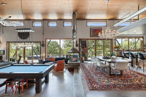 a living room with fireplace furniture and a flat screen tv