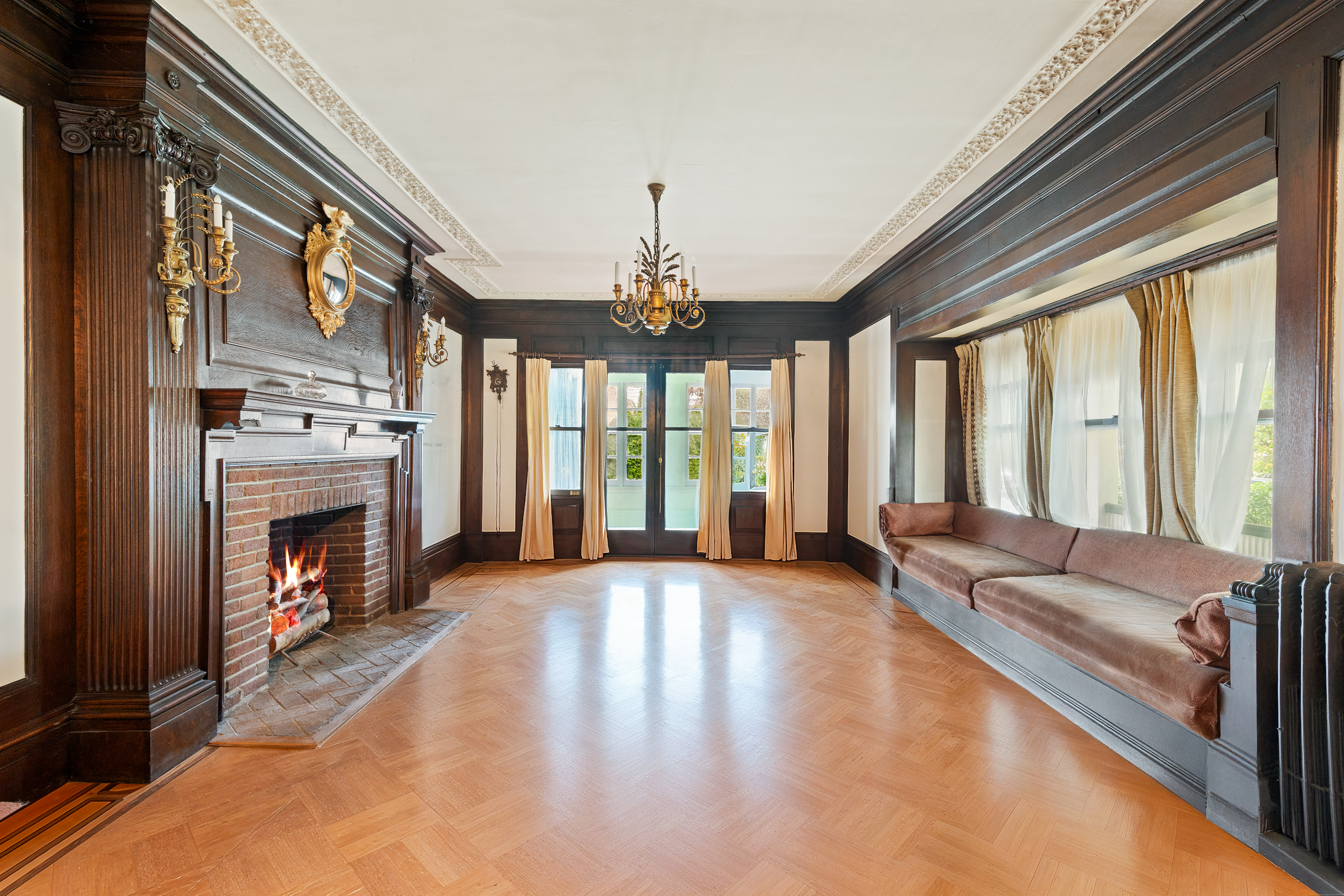 1917 Ditmas Avenue Brooklyn, NY 11226 - Photo 5 of 13 a living room with furniture large window and a fireplace