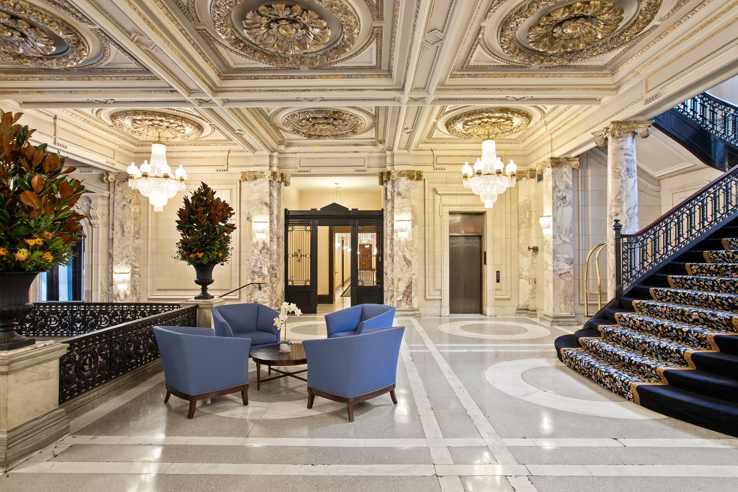 240 Centre Street, Unit 2J Manhattan, NY 10013 - Photo 15 of 18 a living room with furniture and a chandelier