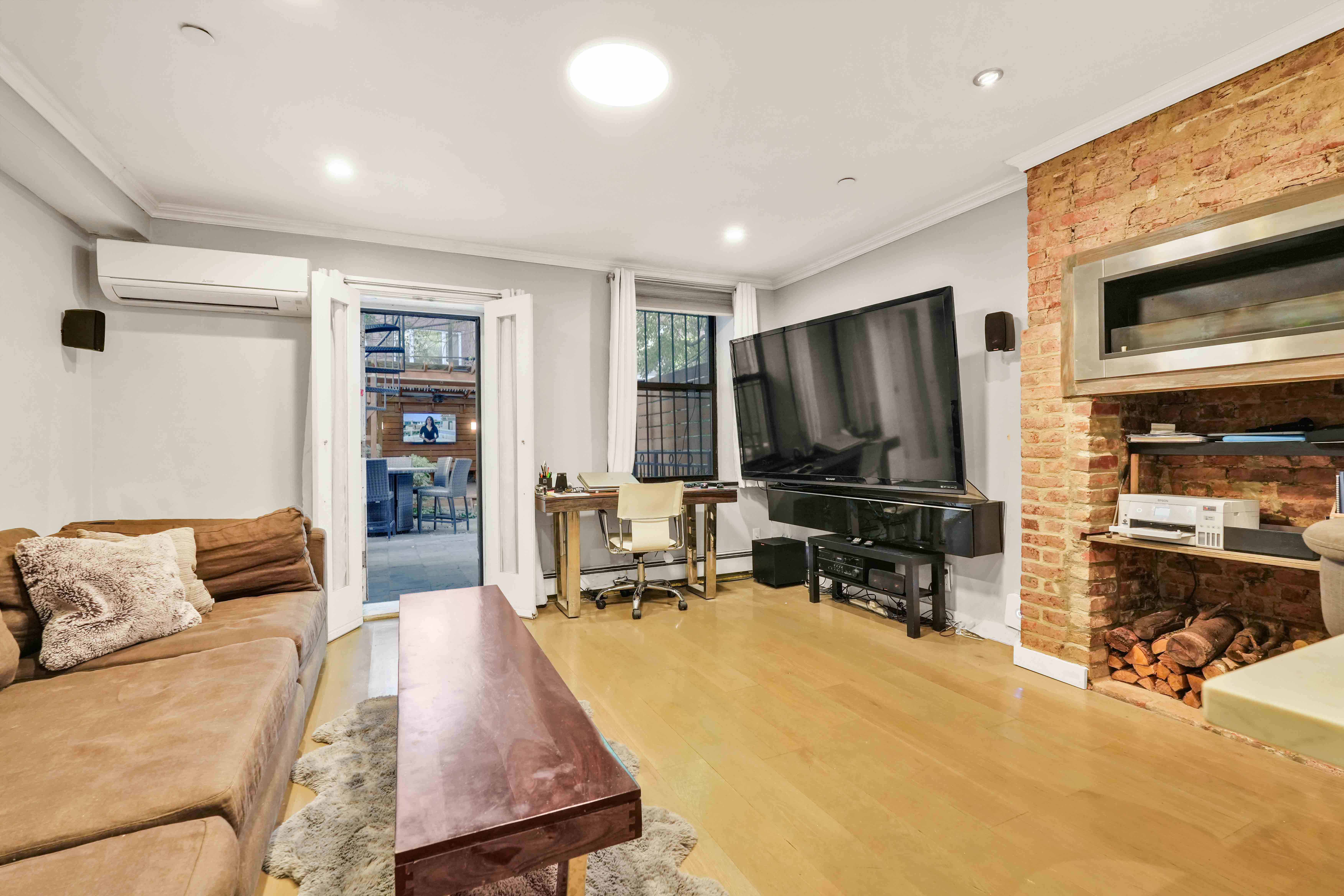 288 St James Place, Unit TRIPLEX Brooklyn, NY 11238 - Photo 7 of 25 a living room with furniture and a flat screen tv
