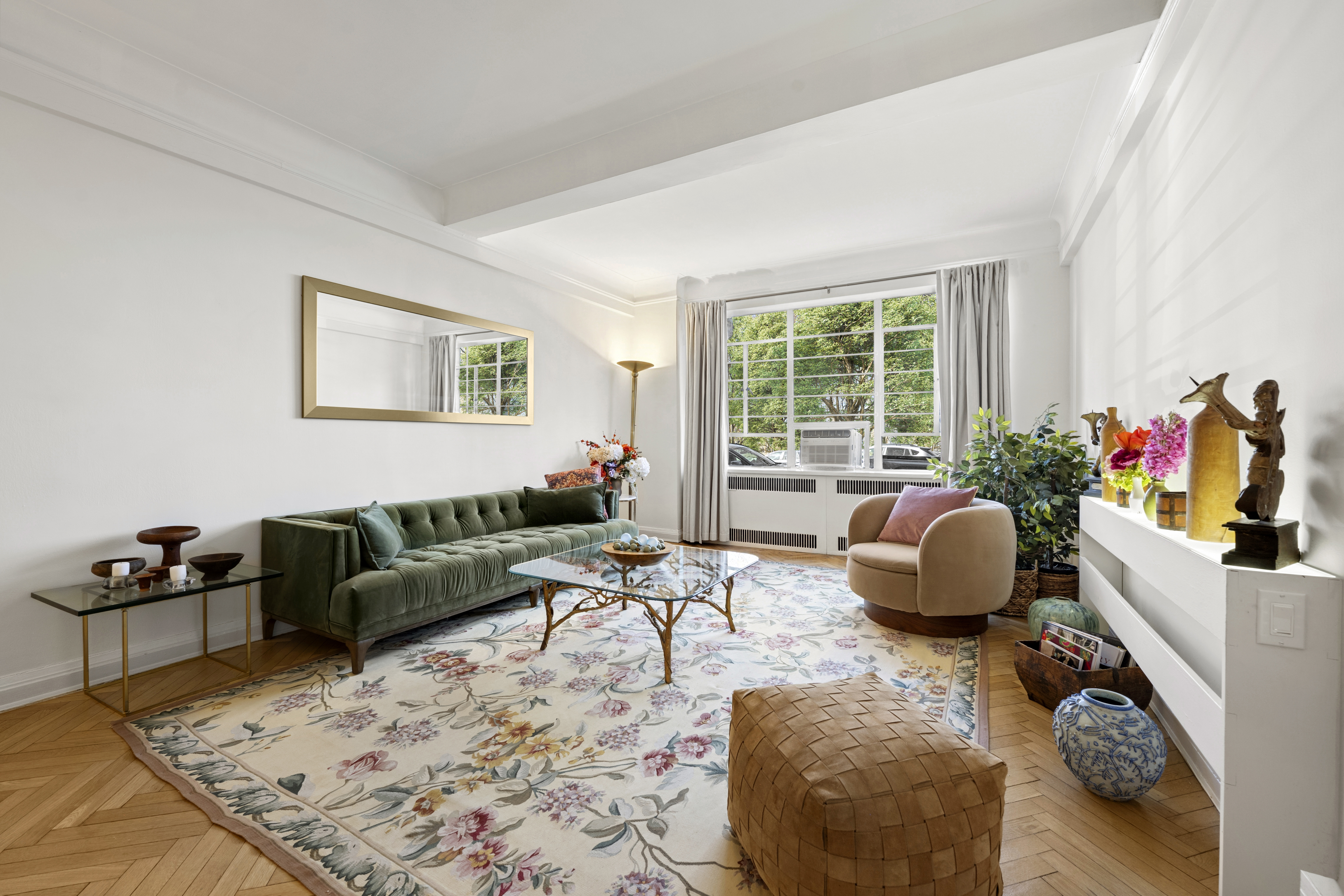 140 Riverside Drive, Unit 1G Manhattan, NY 10024 - Photo 3 of 16 a living room with furniture and a large window