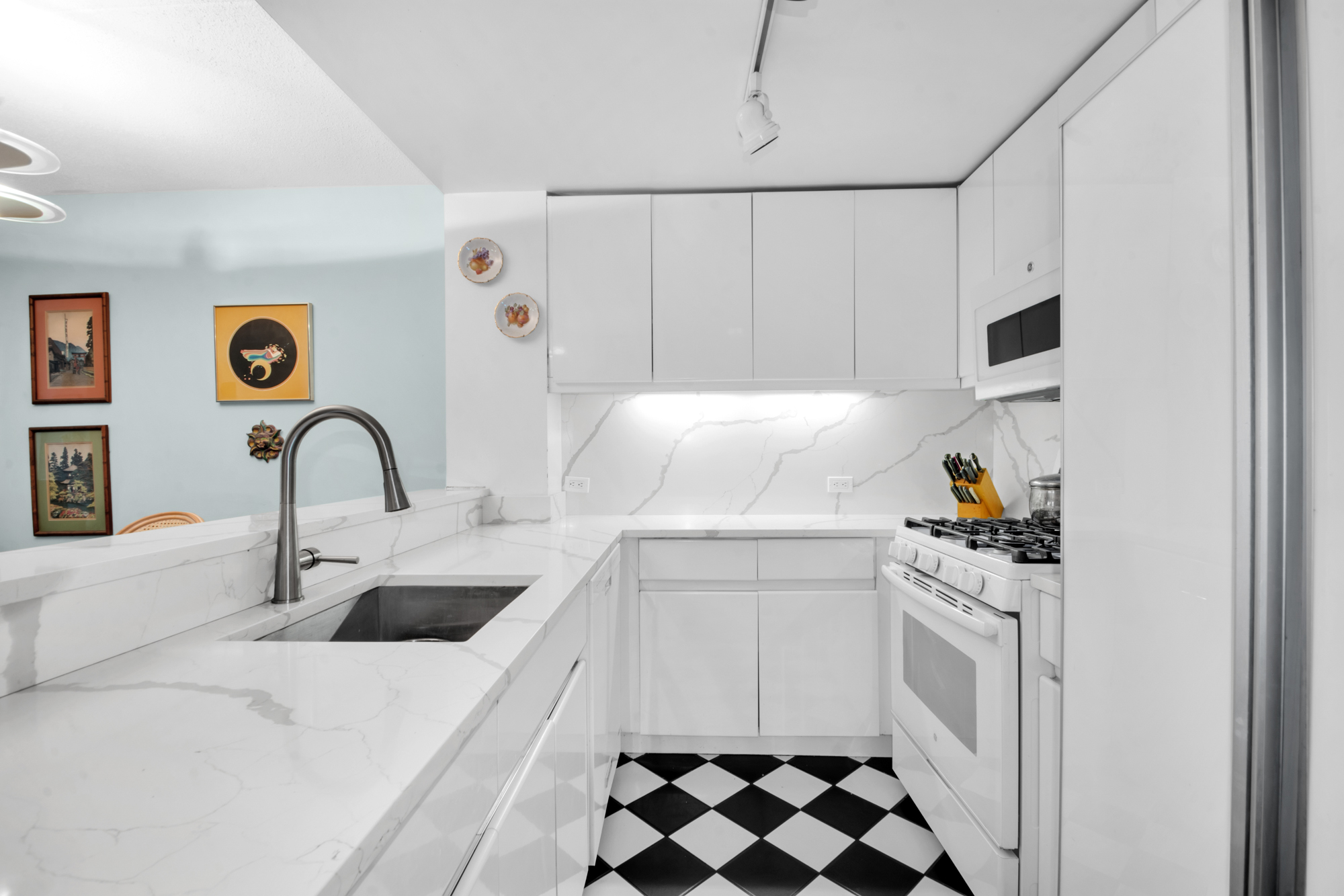 110 West 90th Street, Unit 3M Manhattan, NY 10024 - Photo 3 of 7 a kitchen with a sink and a stove top oven