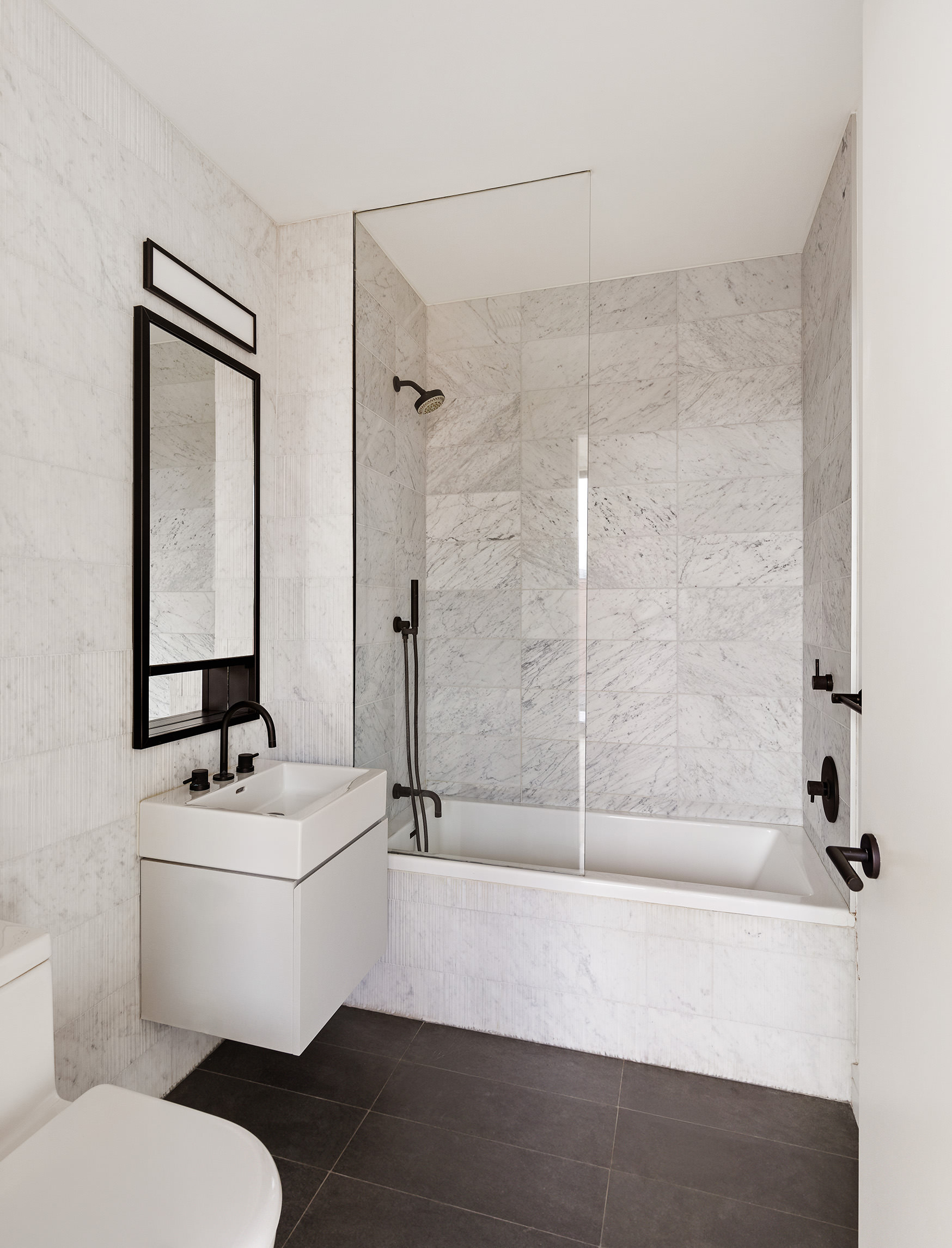 100 Barrow Street, Unit 11A Manhattan, NY 10014 - Photo 15 of 16 a bathroom with a sink toilet and shower