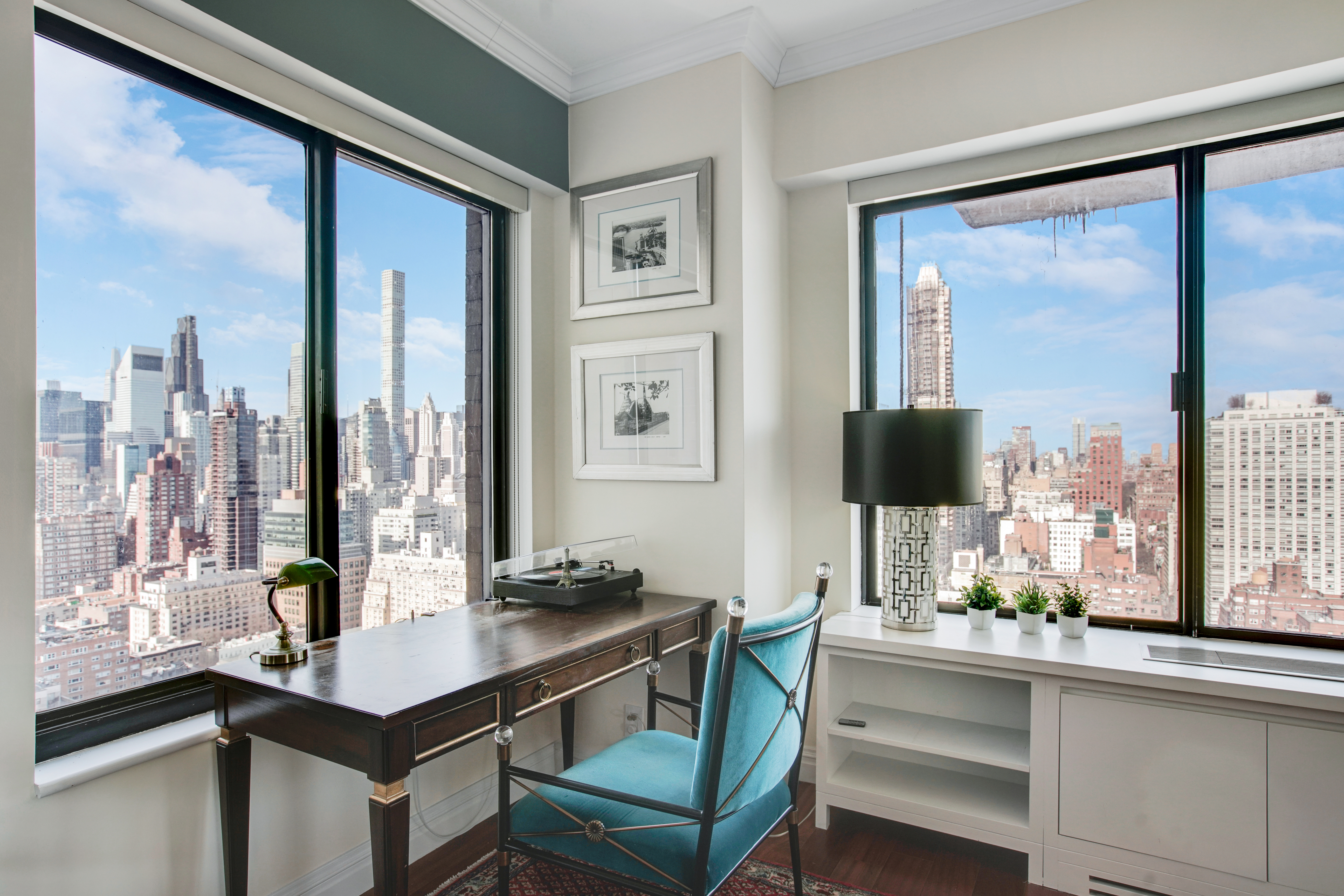 400 East 70th Street, Unit 3301 Manhattan, NY 10021 - Photo 3 of 20 a room with a table and a flat screen tv