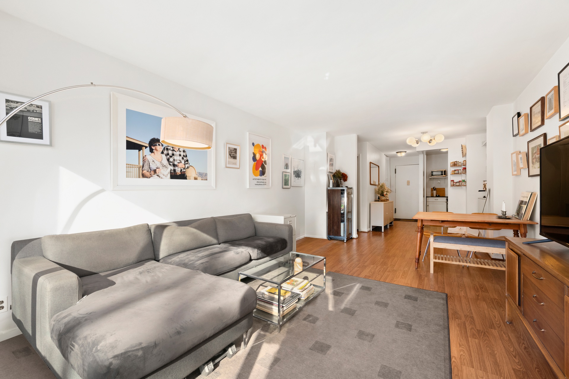 195 Willoughby Avenue, Unit 205 Brooklyn, NY 11205 - Photo 2 of 7 a living room with furniture and a flat screen tv