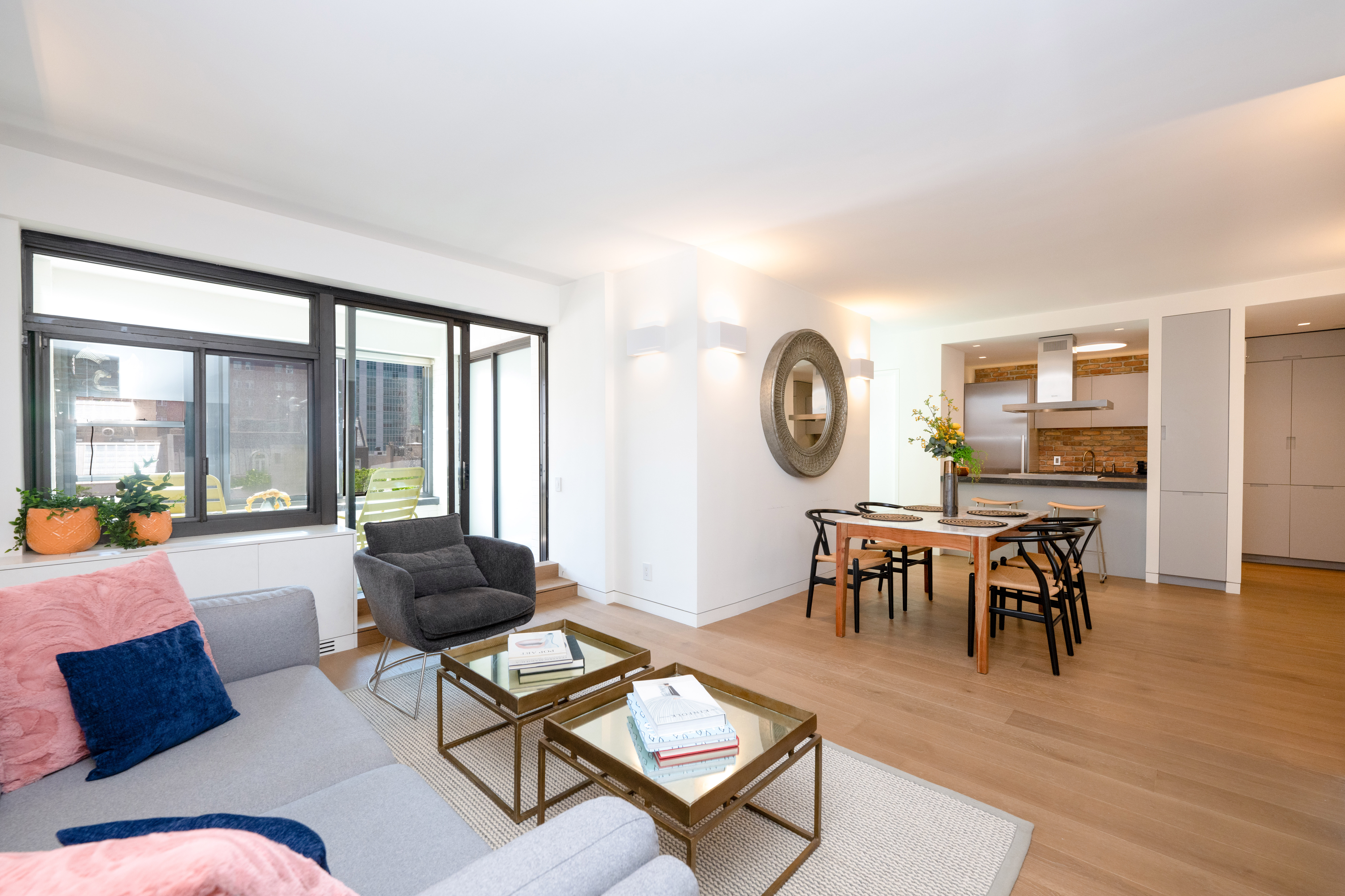 124 East 79th Street, Unit 7D Manhattan, NY 10075 - Photo 1 of 25 a living room with furniture and a large window