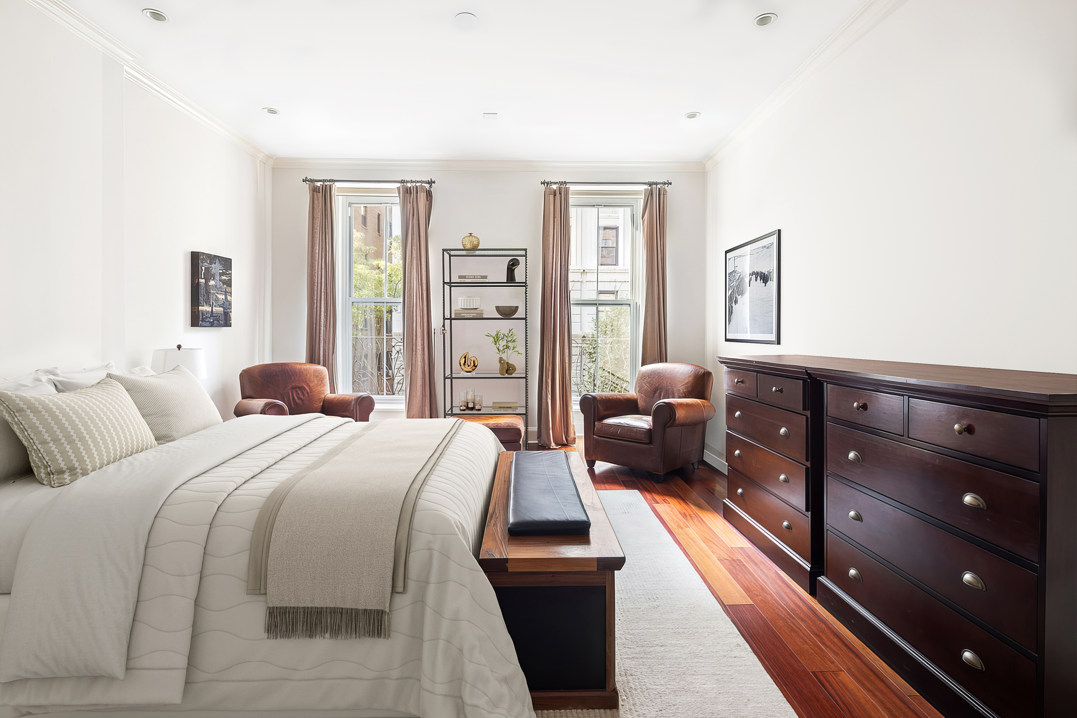 217 West 22nd Street Manhattan, NY 10011 - Photo 7 of 16 a bedroom with a bed and a couch